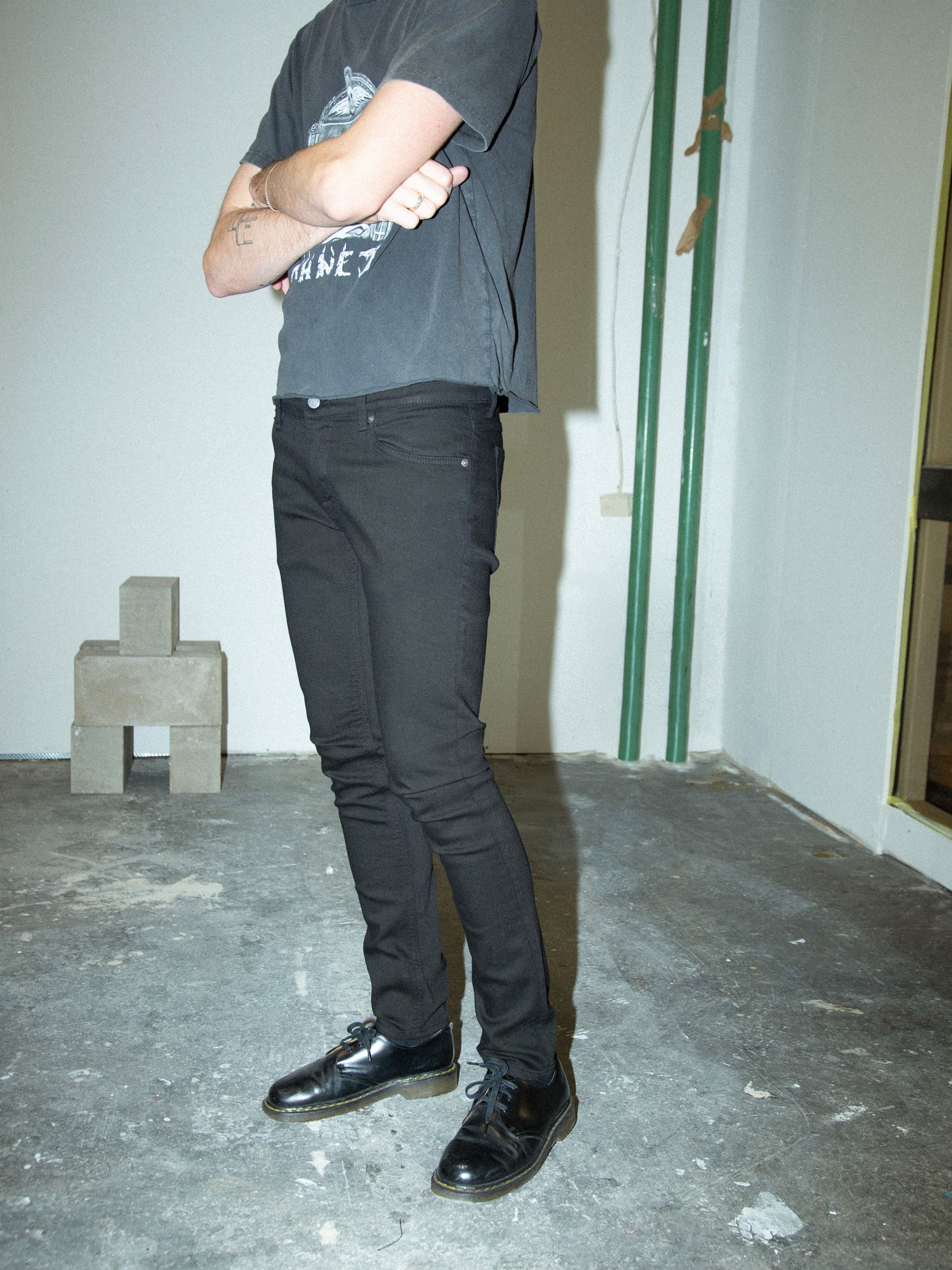 Nudie Jeans Tight Terry Everblack, men's tight fit jeans shown on a model.