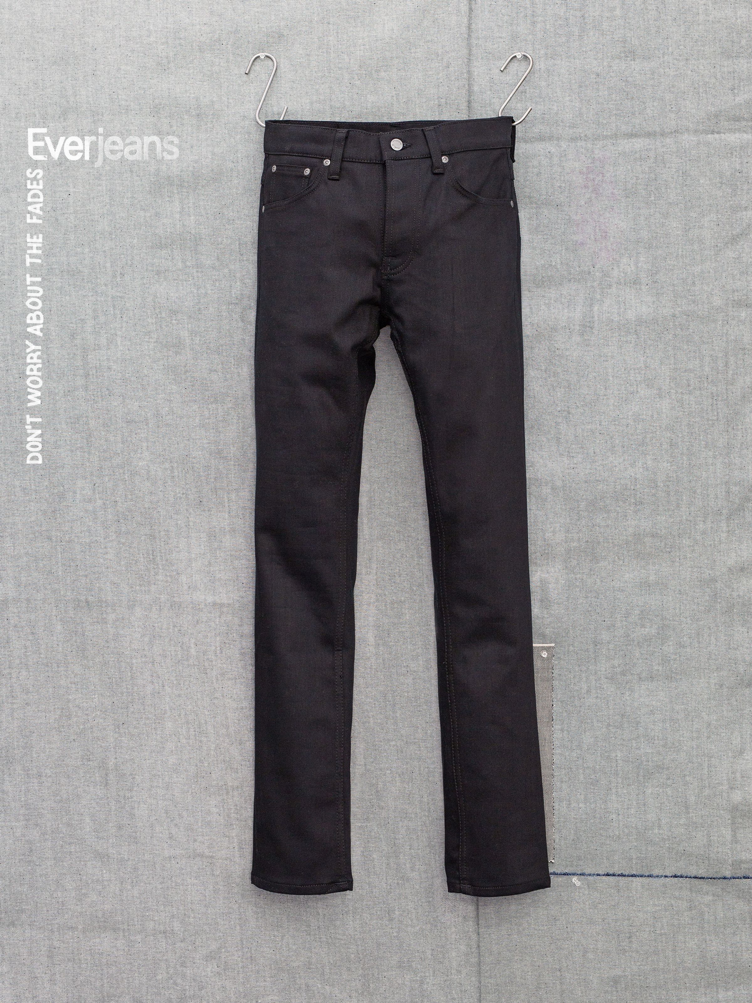 Nudie Jeans Grim Tim Dry Everblack, men's slim fit jeans, shown flat from the front.