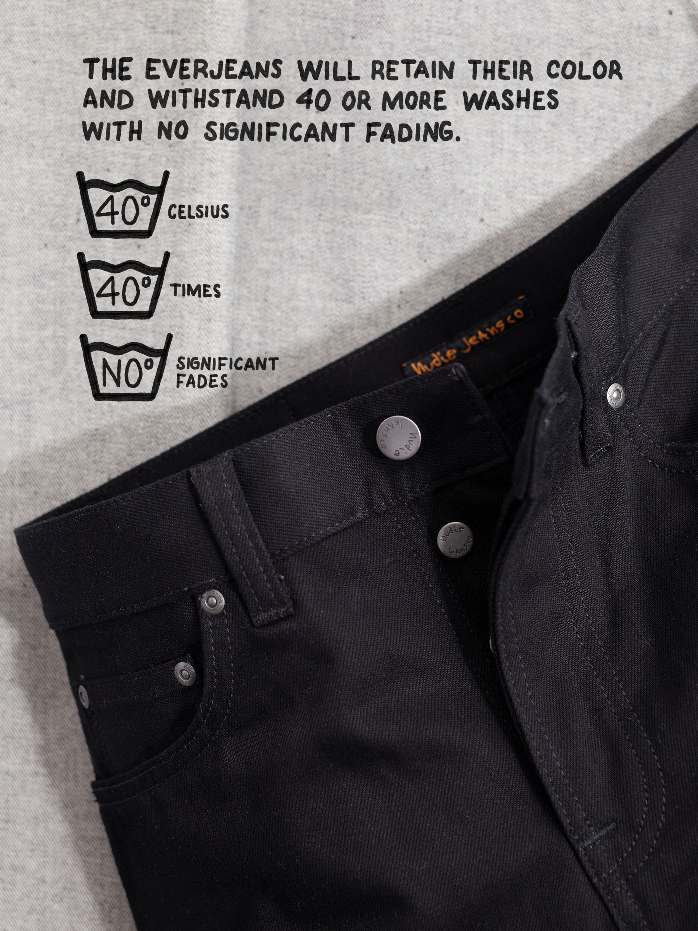 Nudie Jeans Steady Eddie II Dry Everblack, close-up showing the non-fading fabric's wash instructions and colorfastness.