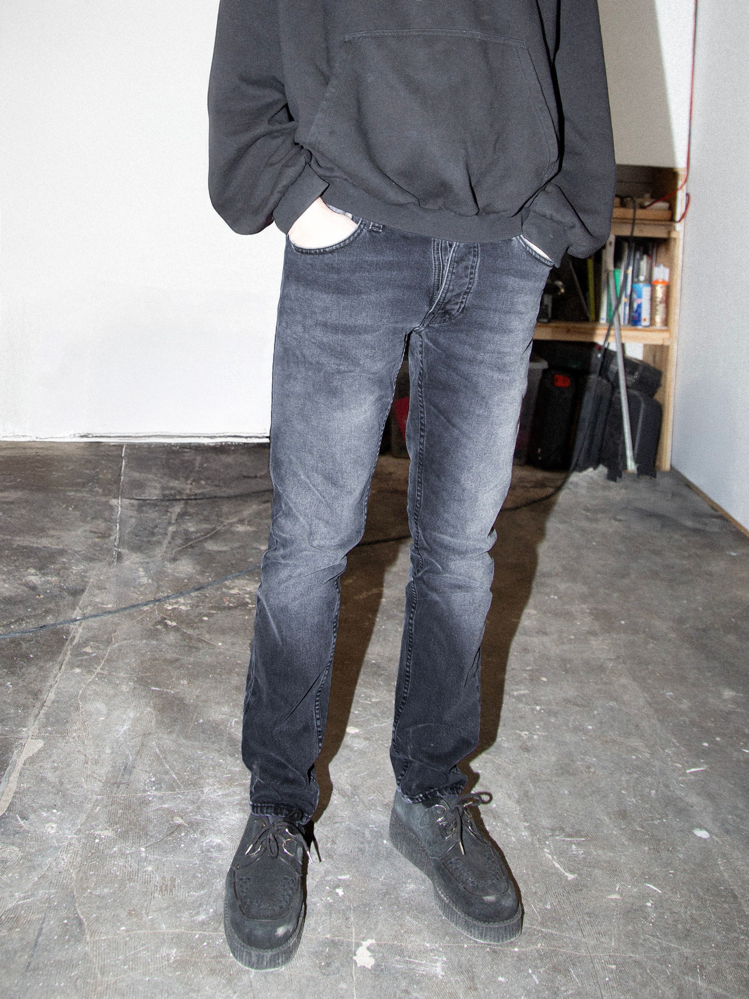 Nudie Jeans Grim Tim Dark Cove, men's slim straight jeans shown on a model from the waist down.