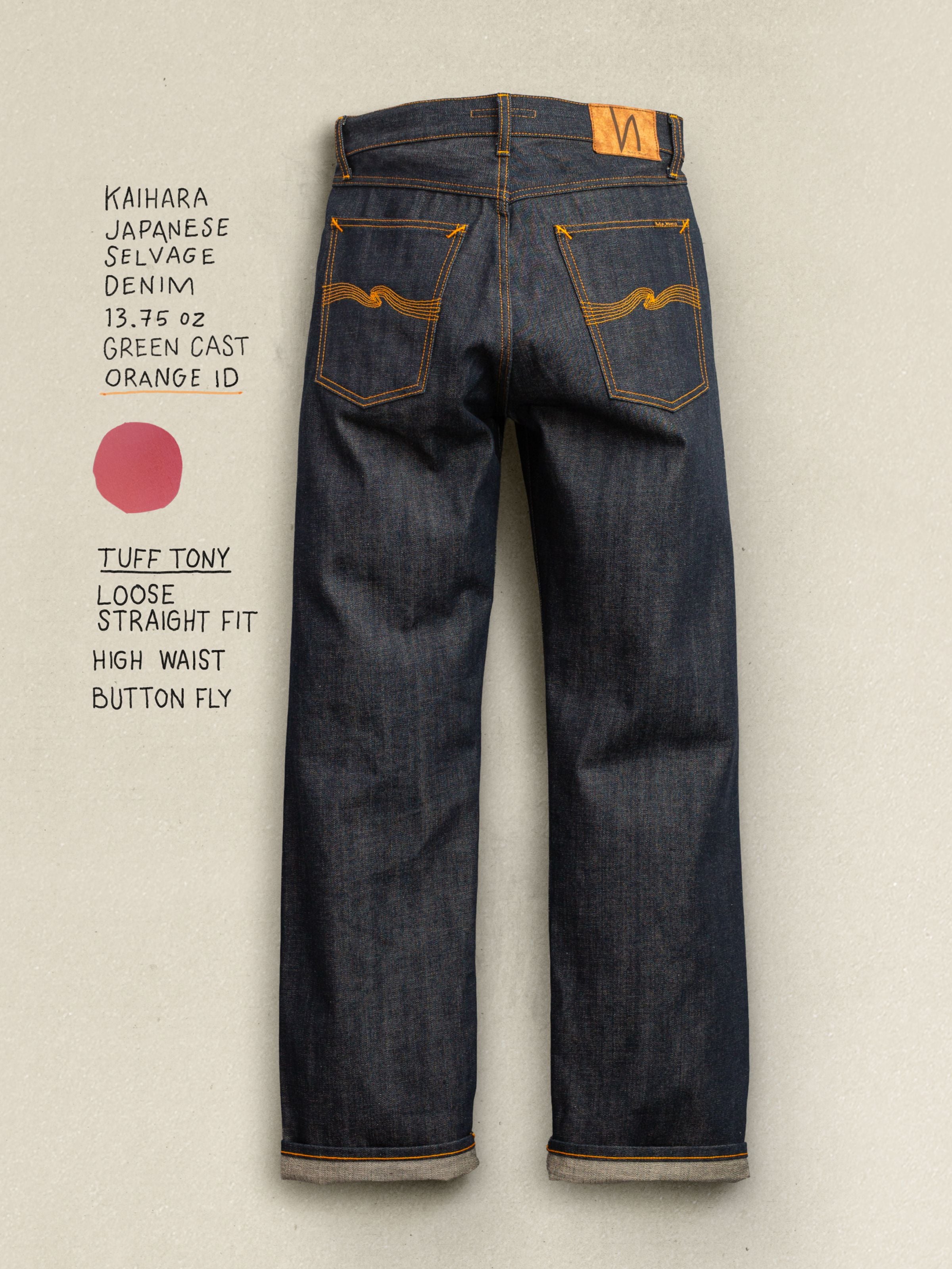 Nudie Jeans Tuff Tony Dry Selvedge, men's loose fit jeans showing the back view with orange embroidery.