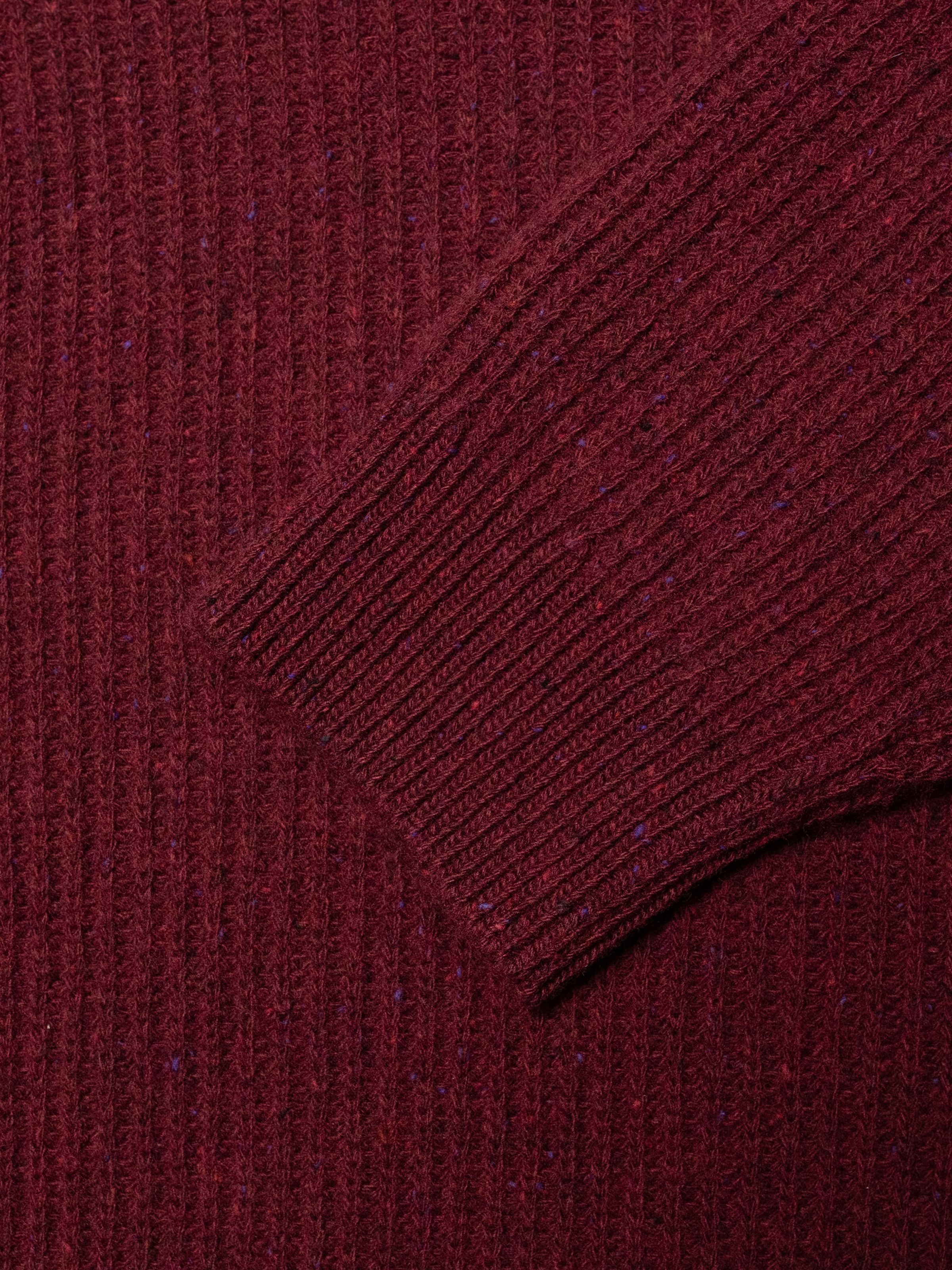 Nudie Jeans August Rib Wool Sweater Burgundy, close-up of the organic wool full cardigan stitch and ribbed cuff.
