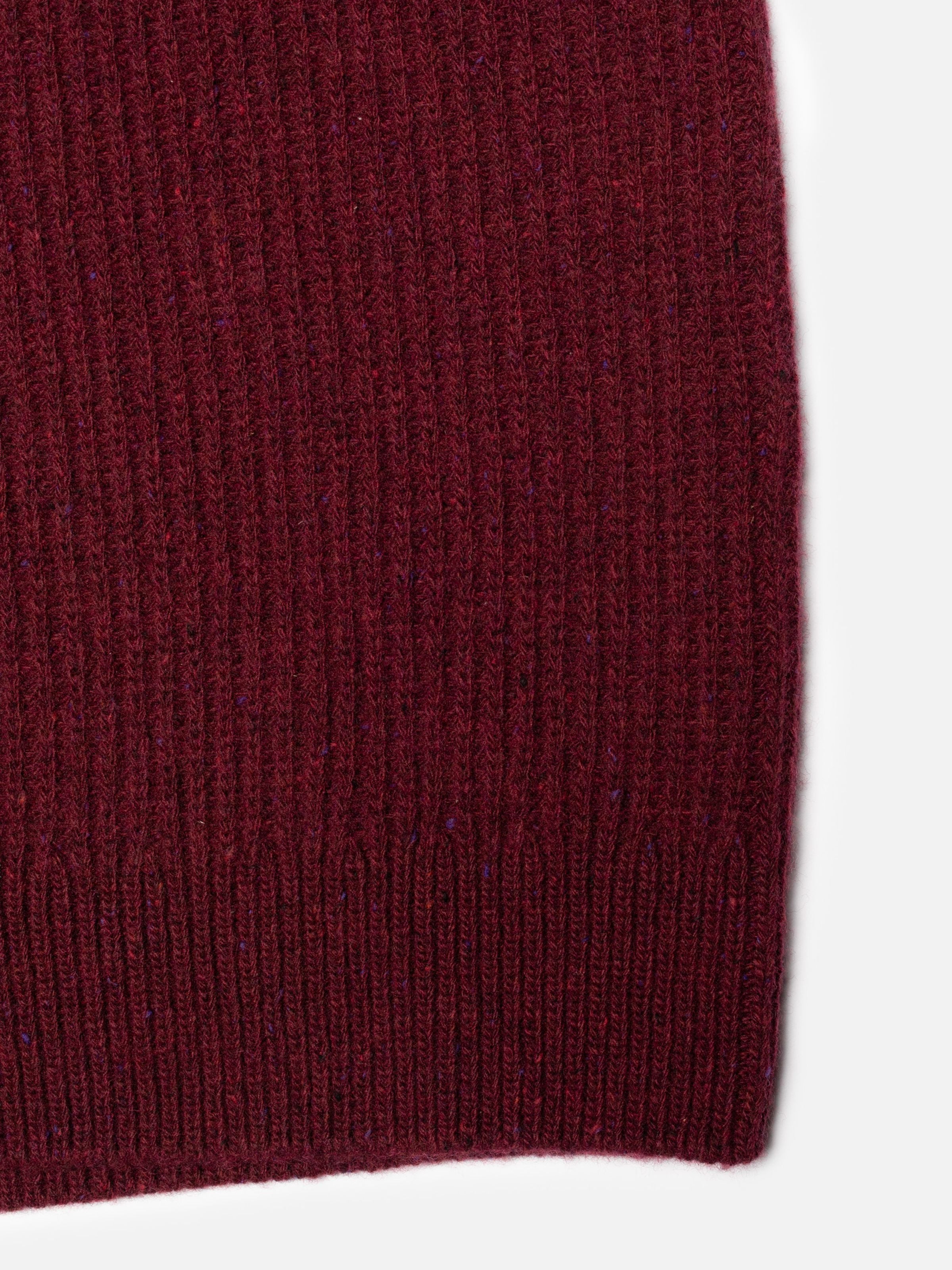 Nudie Jeans August Rib Wool Sweater in Burgundy, close-up of the organic wool in a textured cardigan stitch.
