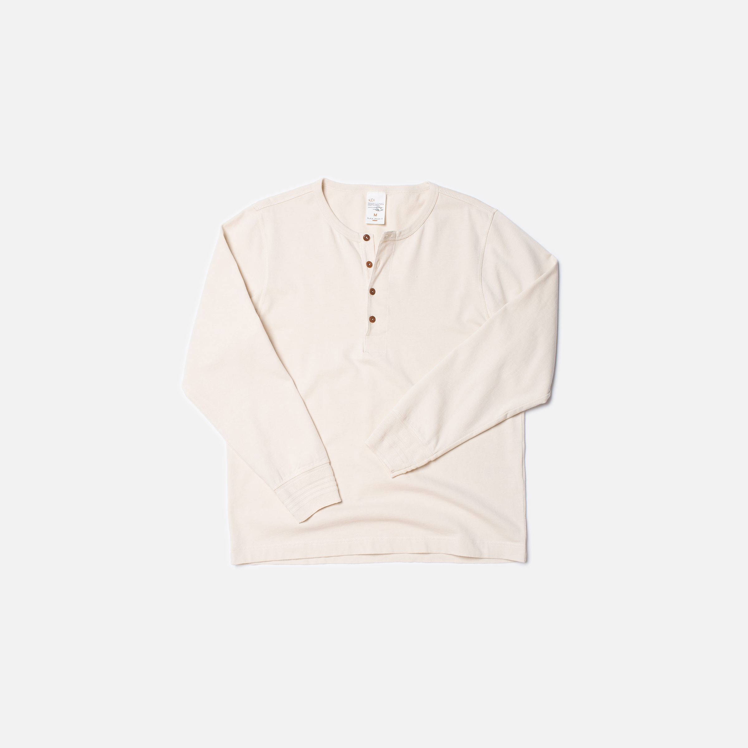 Nudie Jeans LS Henley in Ecru, a men's regular fit long-sleeved shirt shown laid flat against a white background.