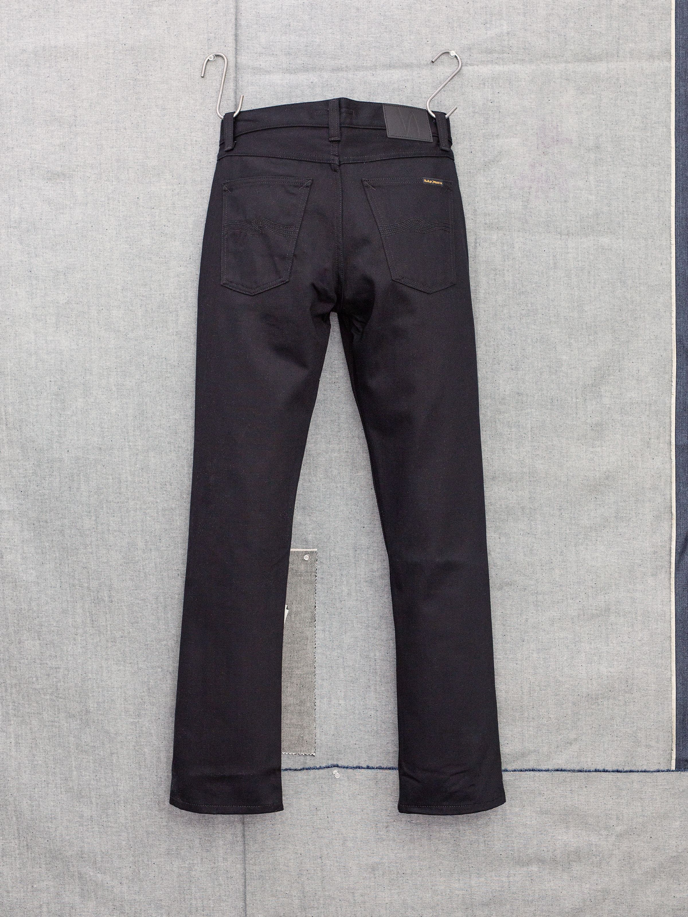 Nudie Jeans Gritty Jackson Dry Everblack, men's regular straight leg jeans, shown from the back.