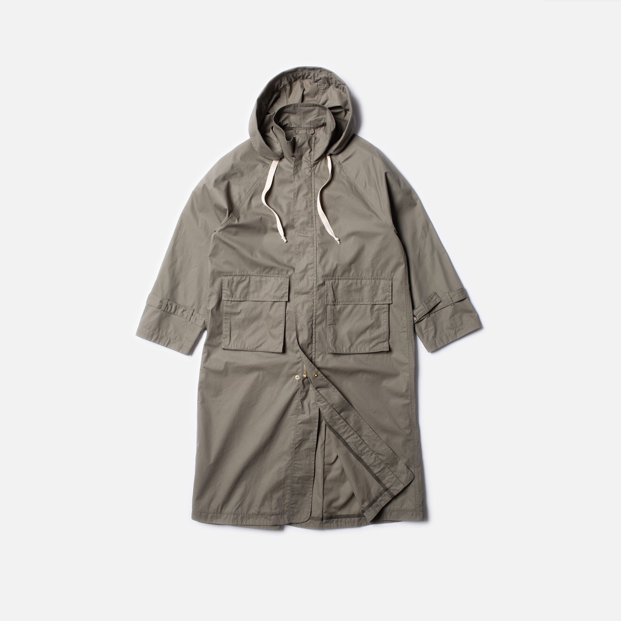 Nudie Jeans Barbro Parka Pale Olive, a women's relaxed fit parka in pale olive cotton, shown laid flat.