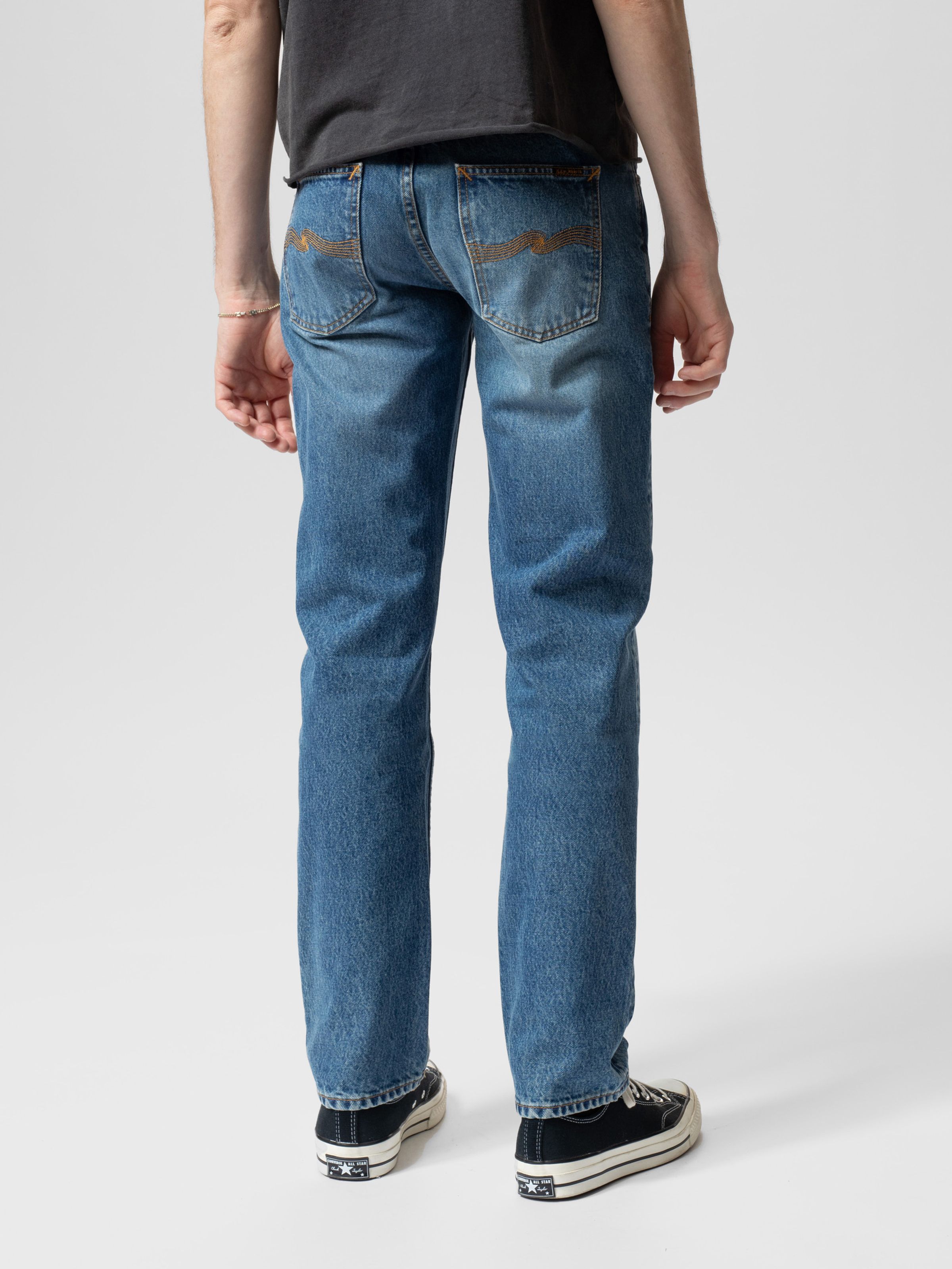 Nudie Jeans Gritty Jackson in Day Dreamer, men's regular fit straight leg jeans shown from the back on a model.