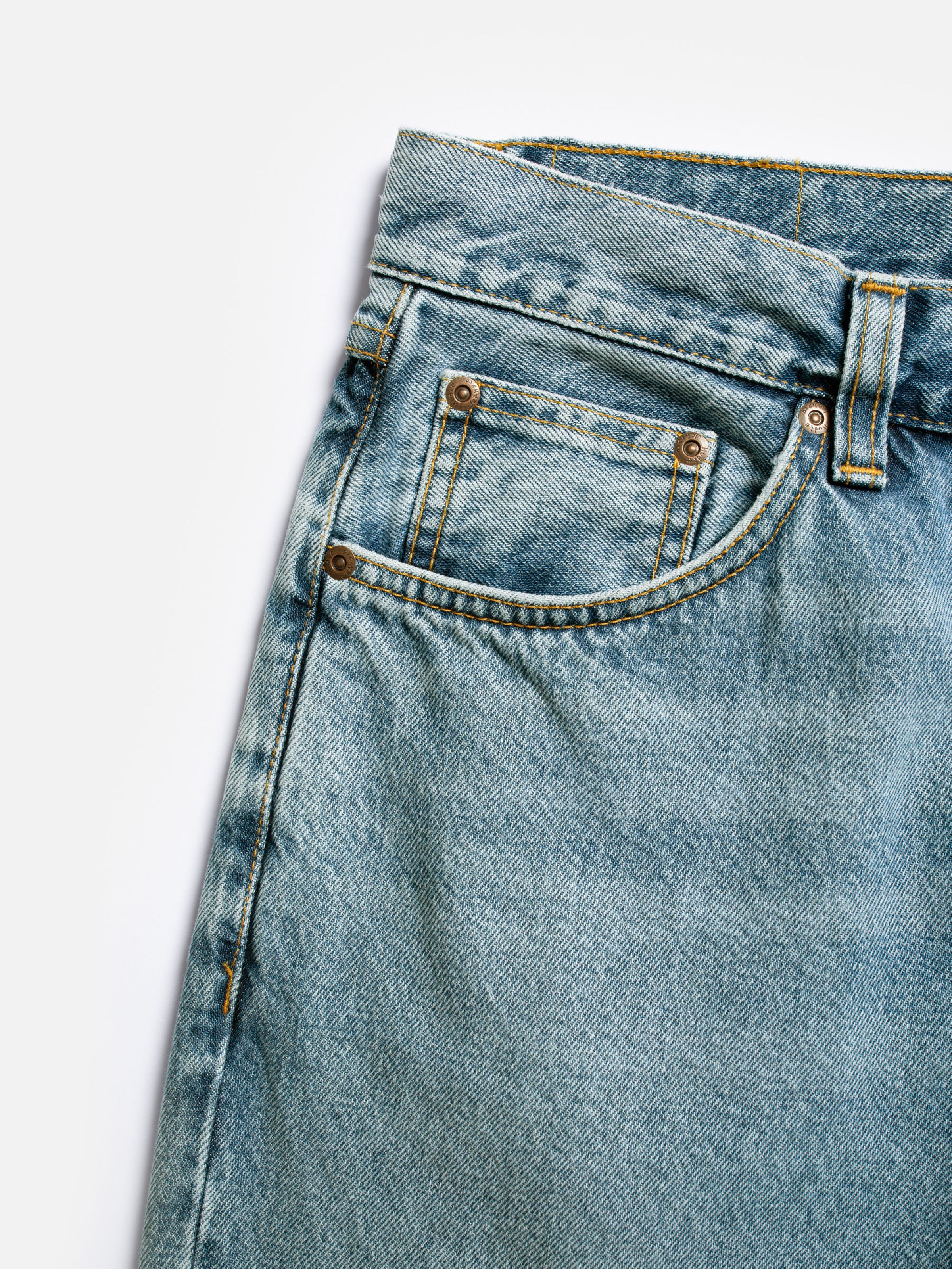 Nudie Jeans Rad Rufus Indigo Blues, men's regular fit straight leg jeans, close-up of the front pocket.