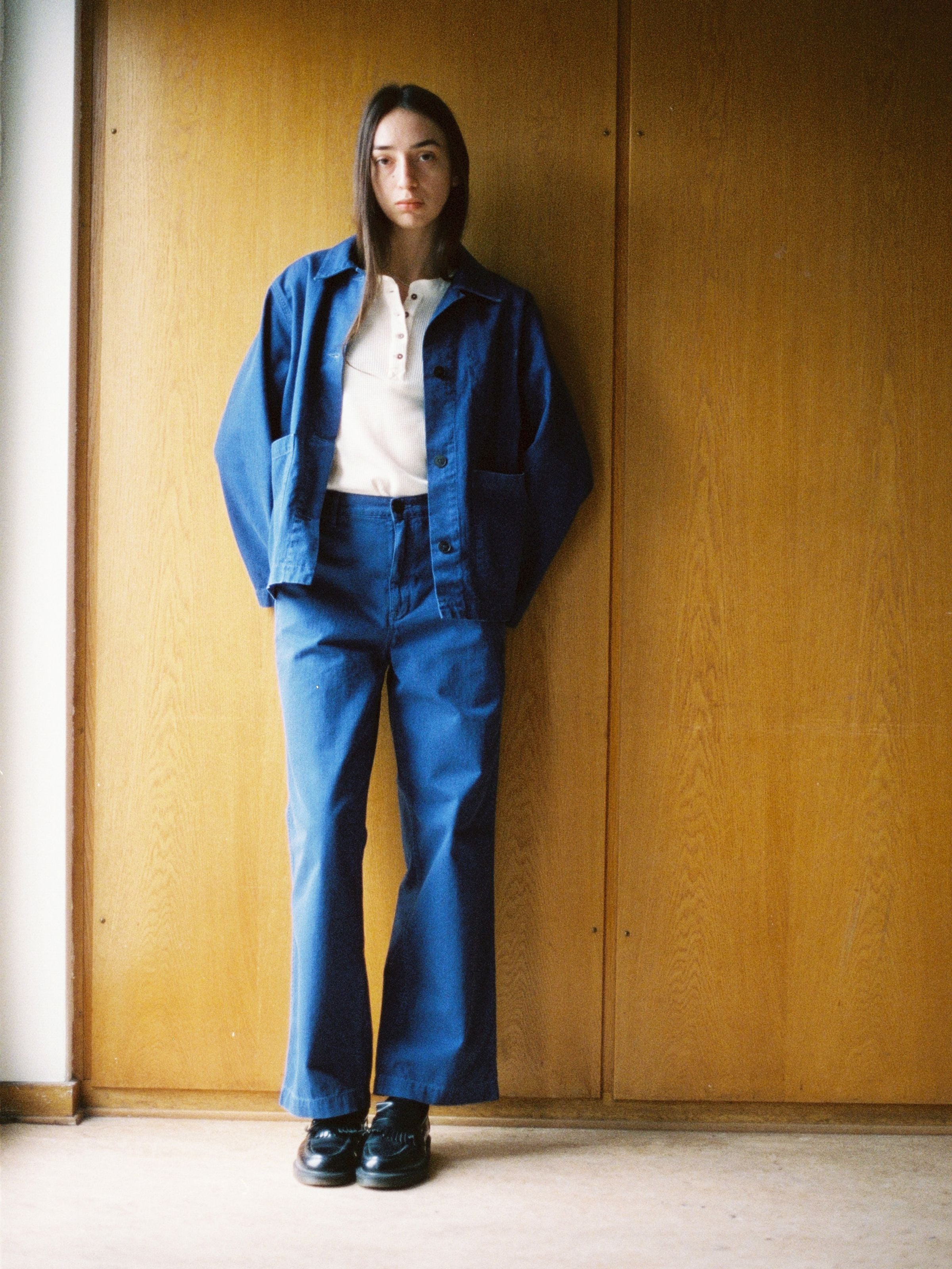Nudie Jeans Wendy Herringbone Denim Pants in blue, wide-leg trousers shown on a model with a matching workwear jacket.