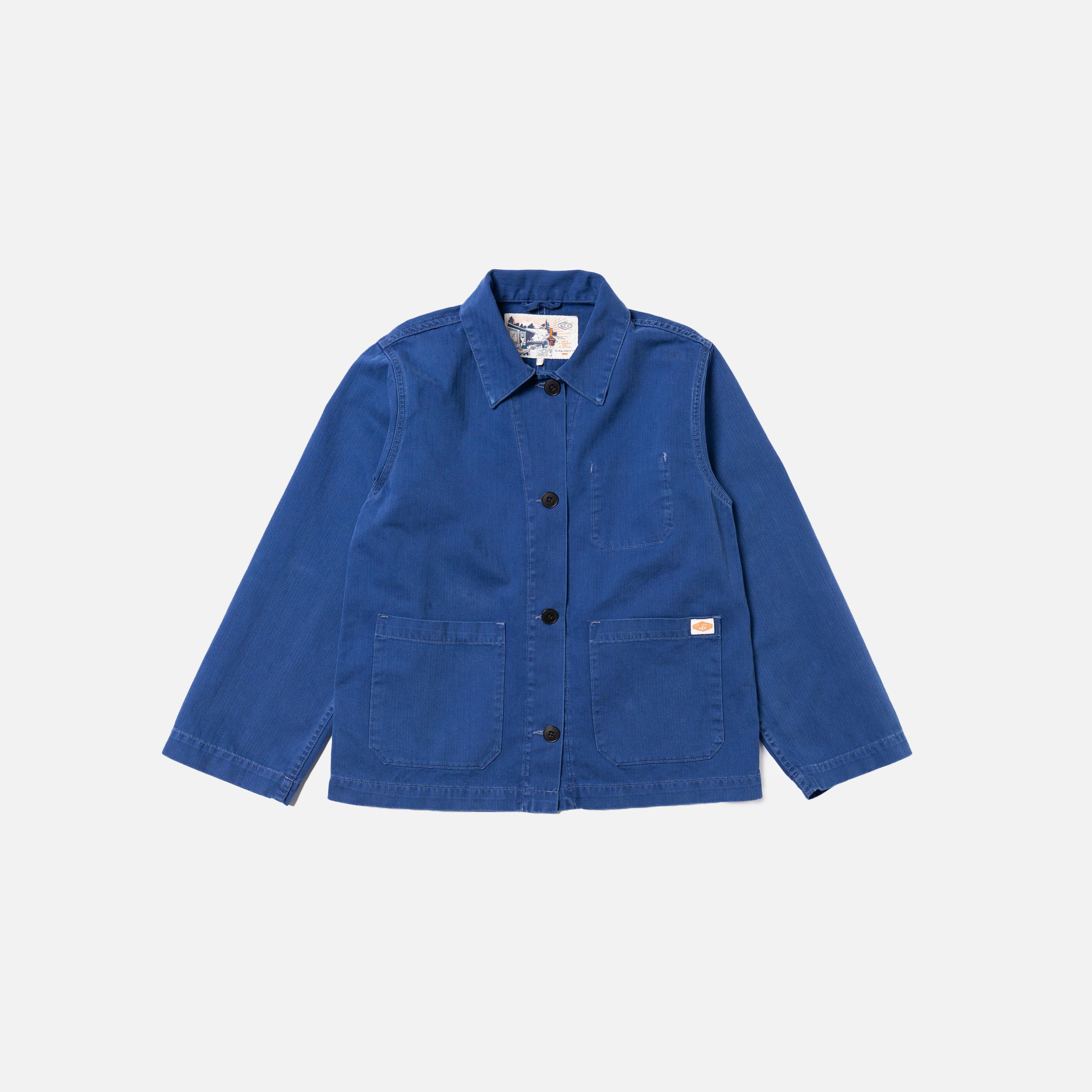 Nudie Jeans Lovis Herringbone Jacket in Blue, a women's regular fit work jacket laid flat against a light background.