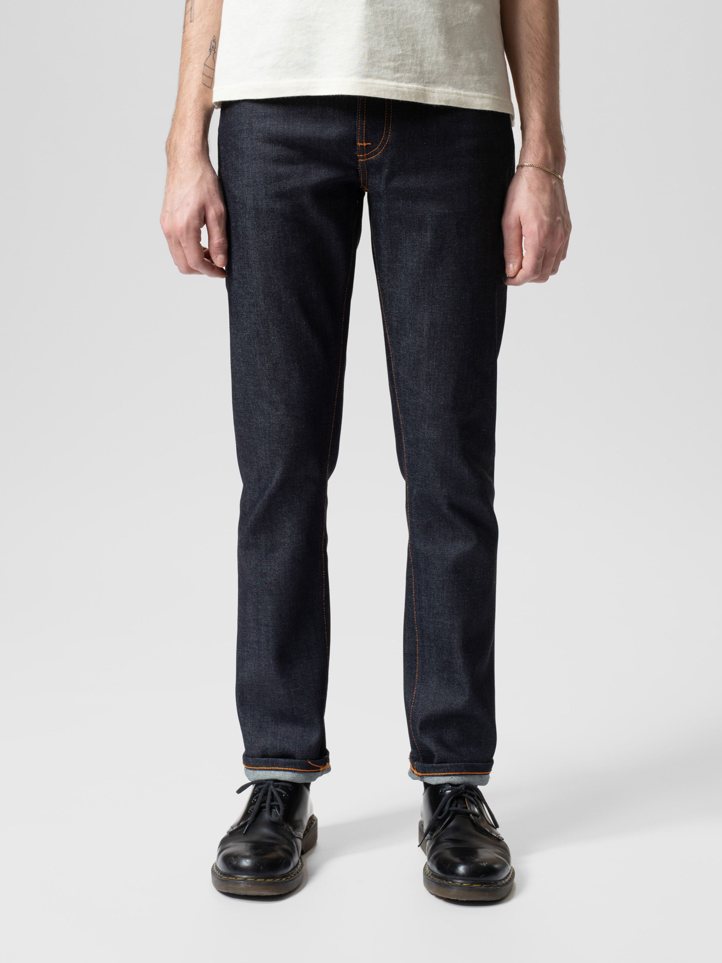 Nudie Jeans Grim Tim Dry Japan Selvage, a men's slim fit jean shown on a model from the front.