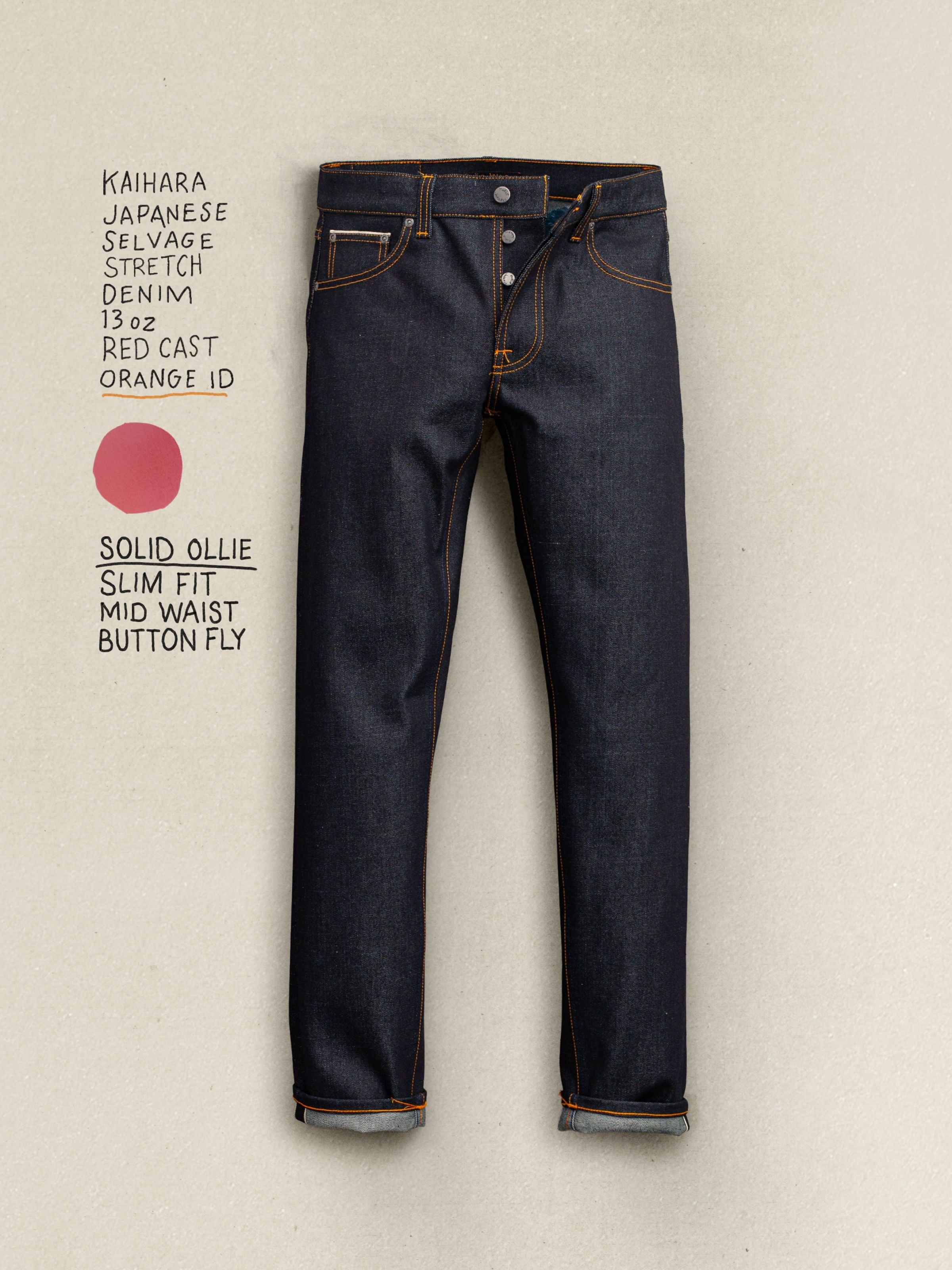 Nudie Jeans Solid Ollie Dry Japan Selvedge, slim fit jeans in dark indigo selvedge denim shown in a full flat shot.