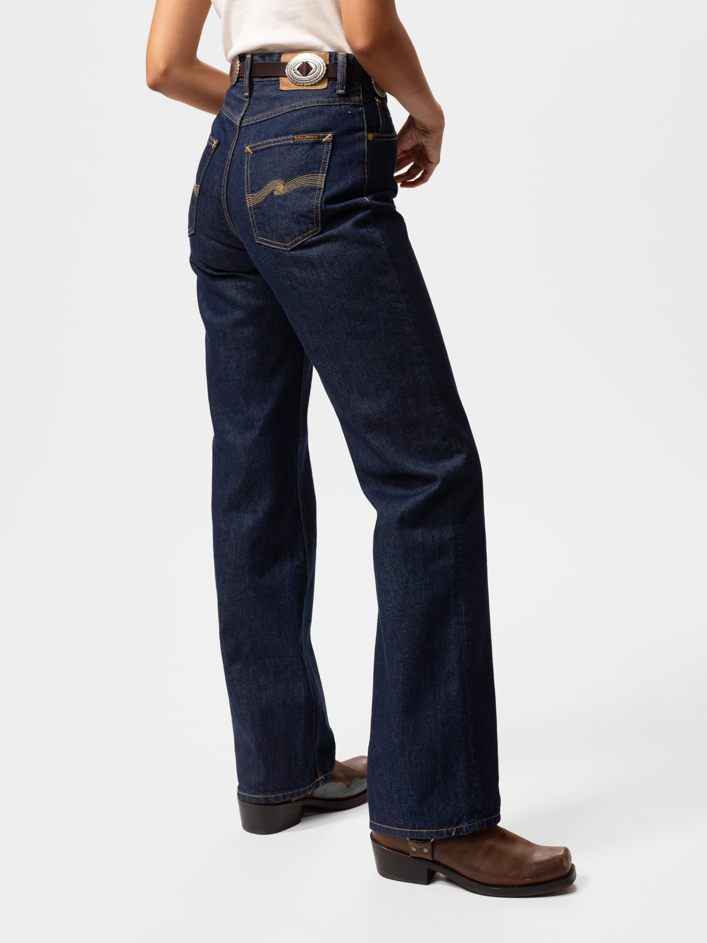 Nudie Jeans Clean Eileen Classic Blue, women's loose wide-leg jeans in dark blue denim, shown from the back on a model.