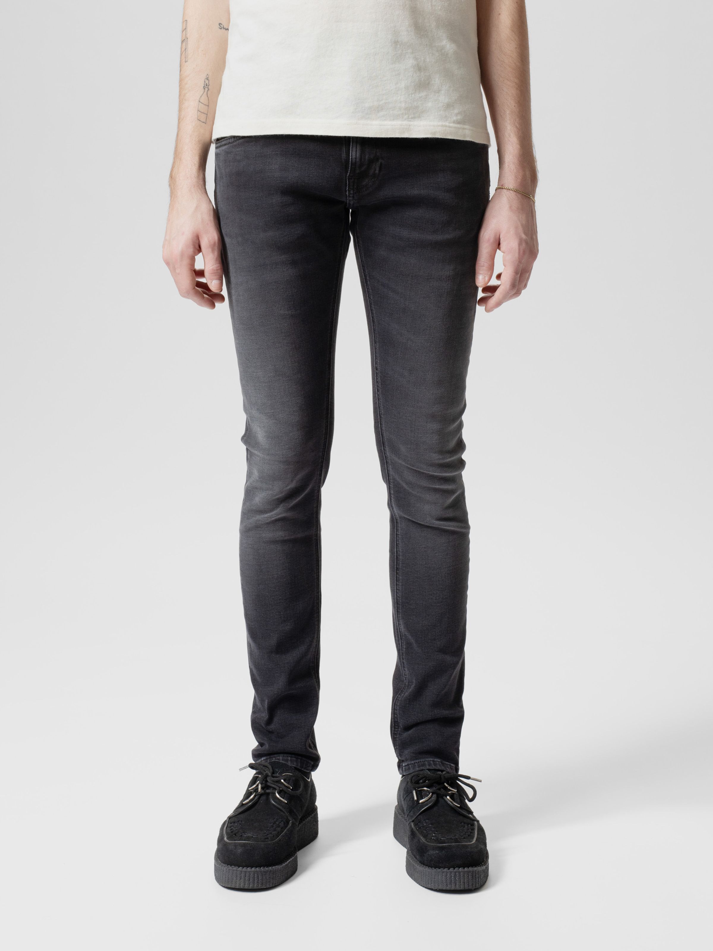 Nudie Jeans Tight Terry in Black Blizzard, men's tight fit jeans in a dark grey wash, shown from the front on a model.