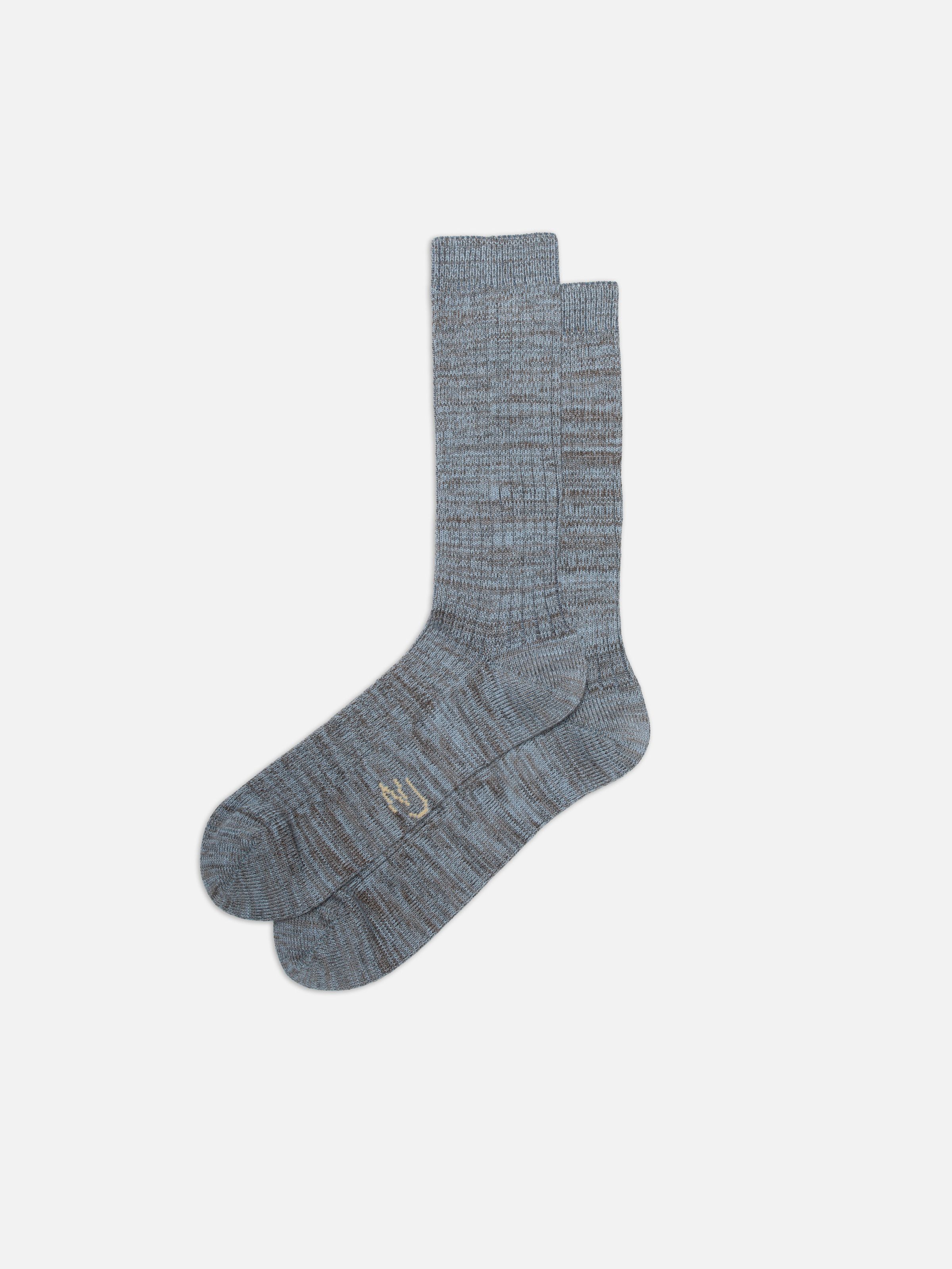 Nudie Jeans Rasmusson Mens Rib Sock, a pair of men's ribbed socks in bluemelange, shown laid flat.