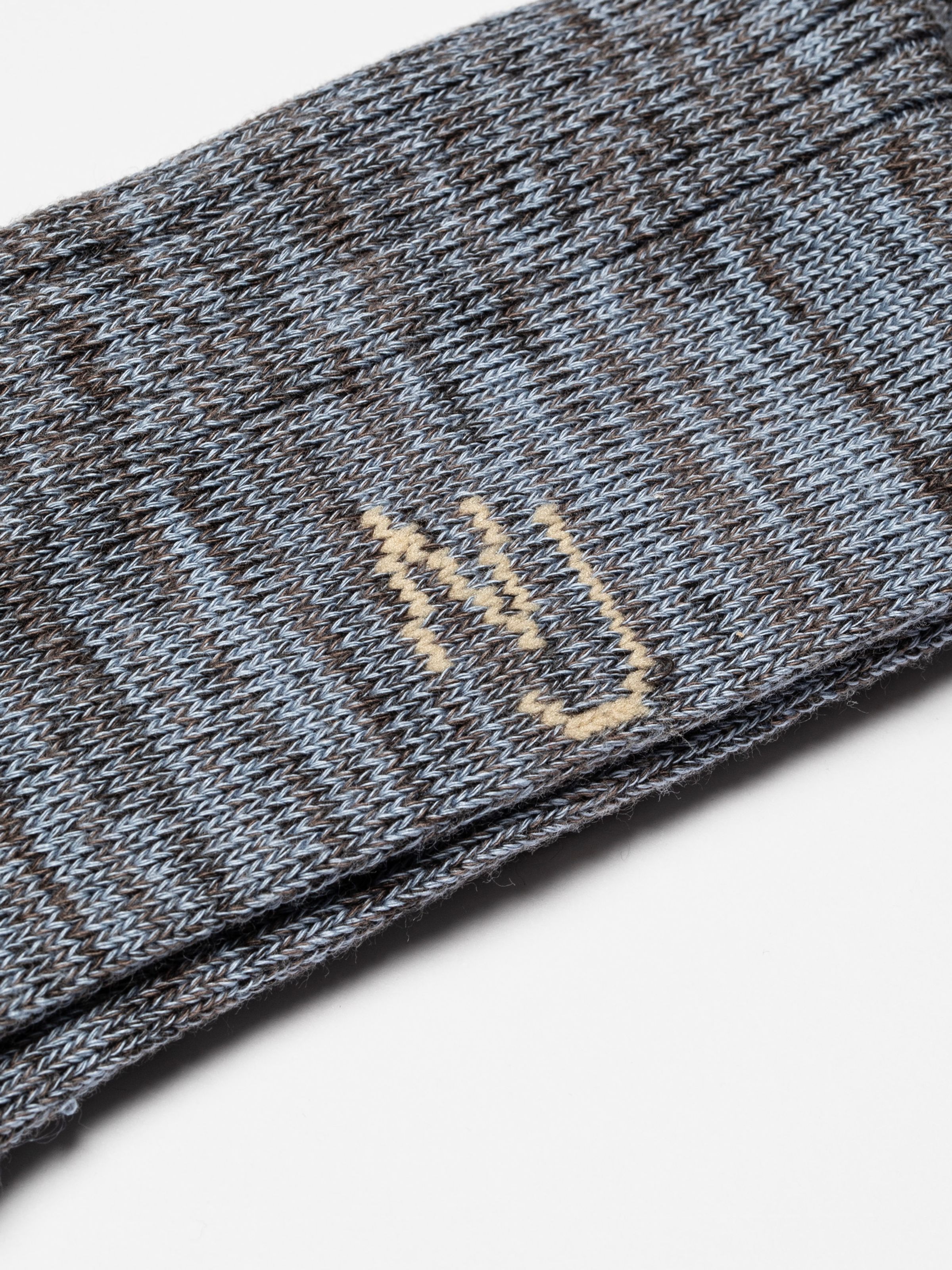 Nudie Jeans Rasmusson Mens Rib Sock in Bluemelange, showing a close-up of the ribbed melange knit and the NJ logo.