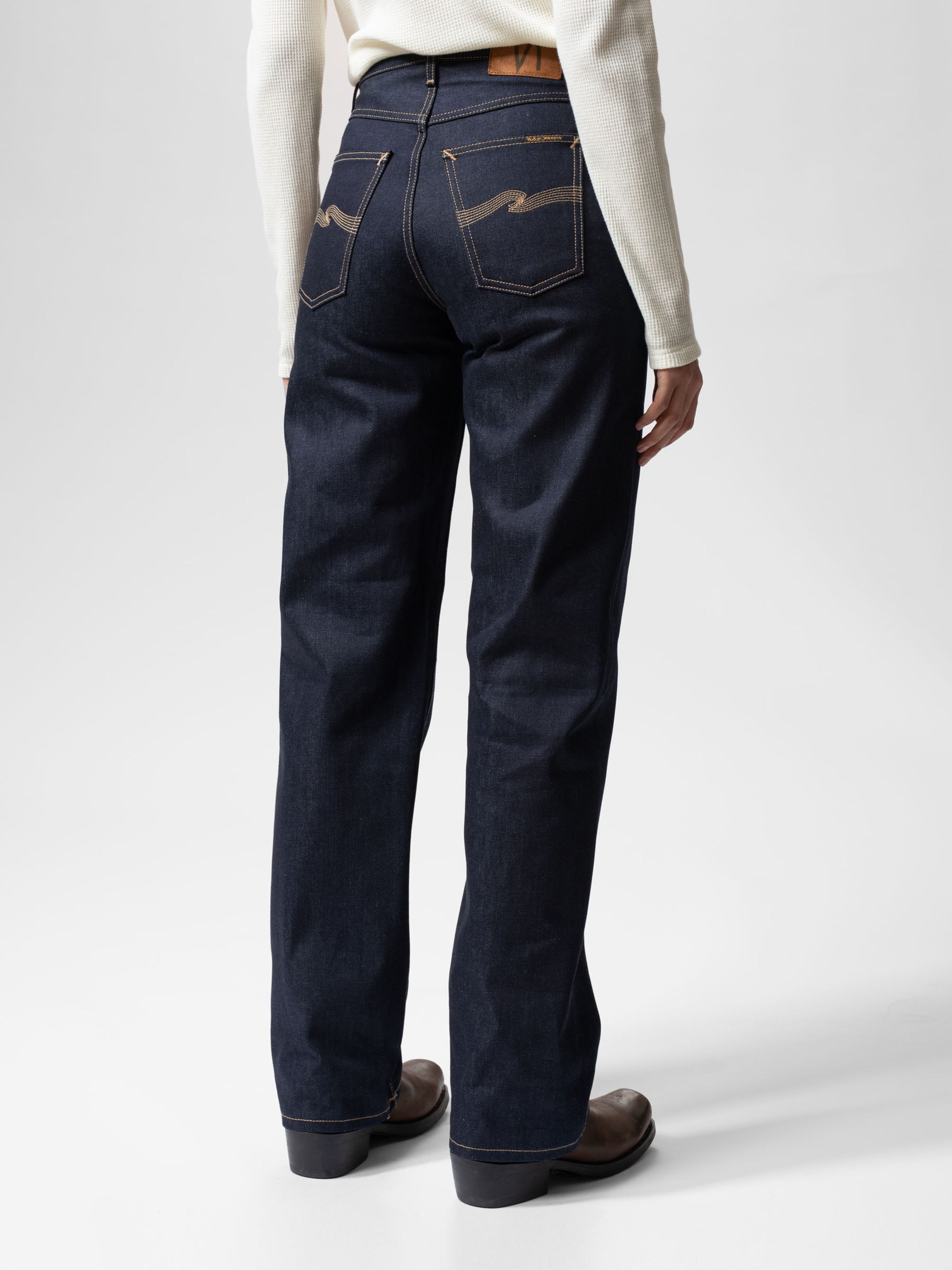 Nudie Jeans Clean Eileen Dry Twilight Selvage, women's loose wide-leg jeans shown from the back on a model.