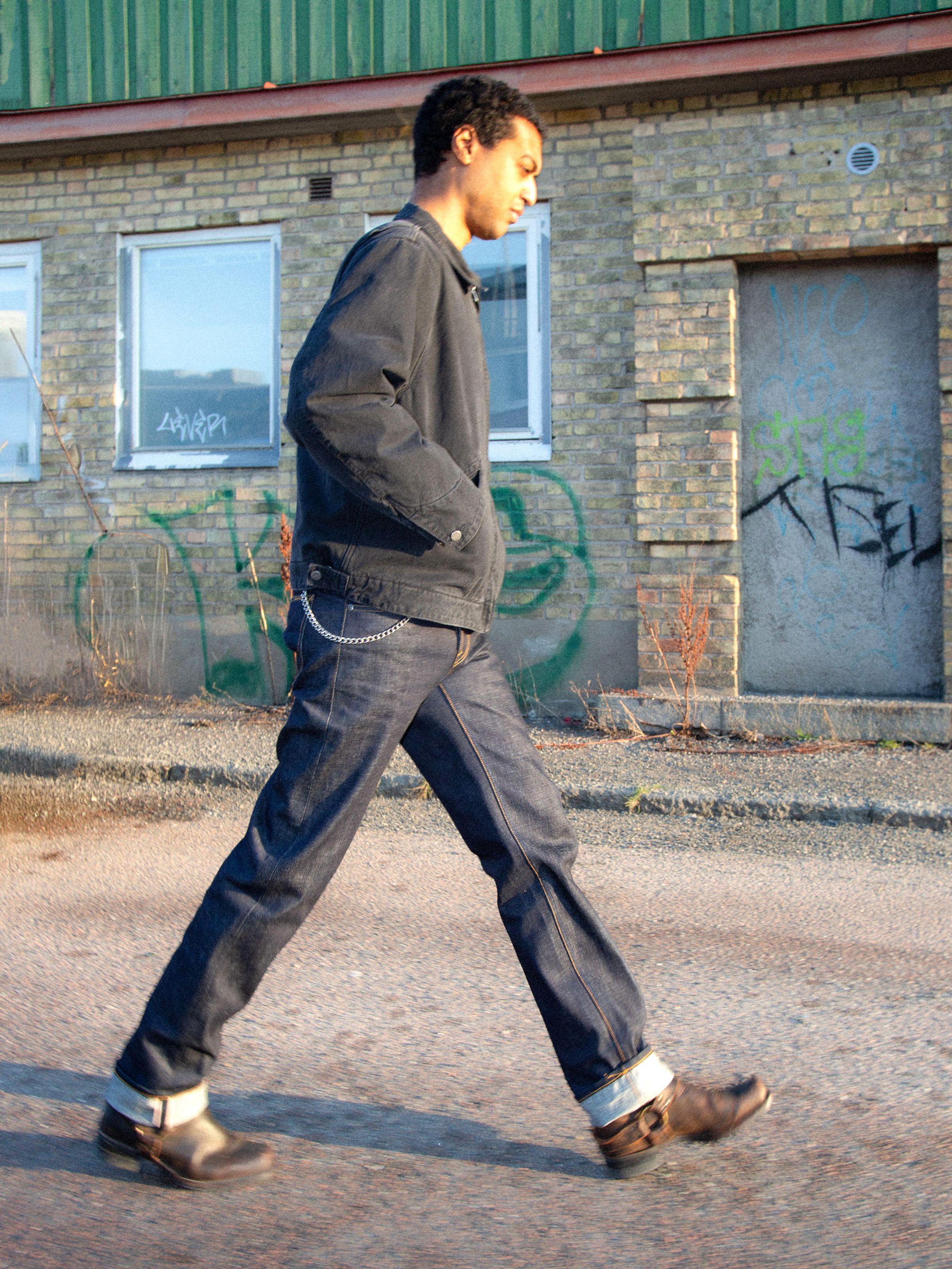 Nudie Jeans Rad Rufus Dry Ace Selvage, men's regular straight fit jeans shown on a model walking.