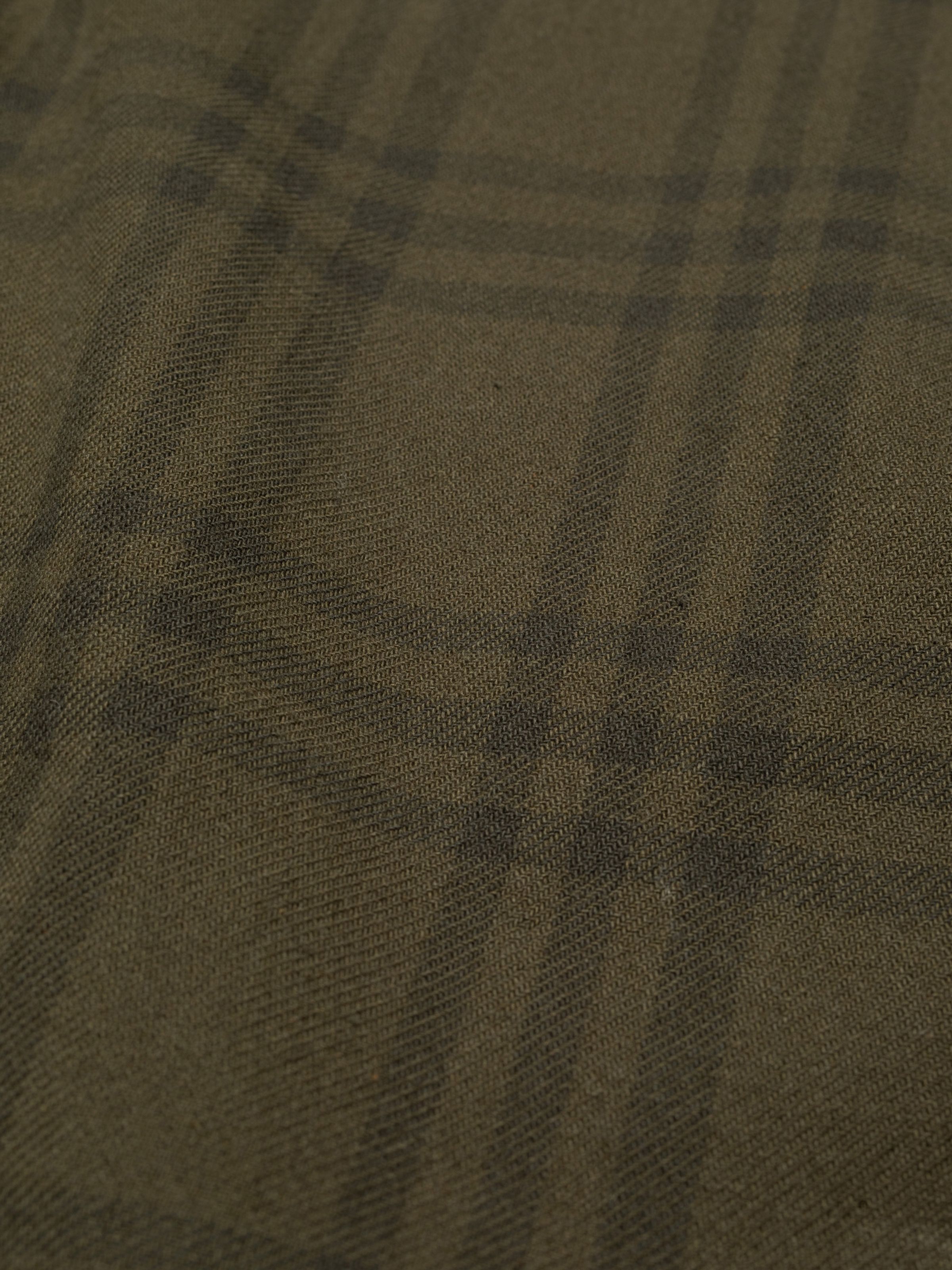 Nudie Jeans Julian Worker Plaid Check Shirt in Olive, close-up of the olive green and dark green checked twill fabric.