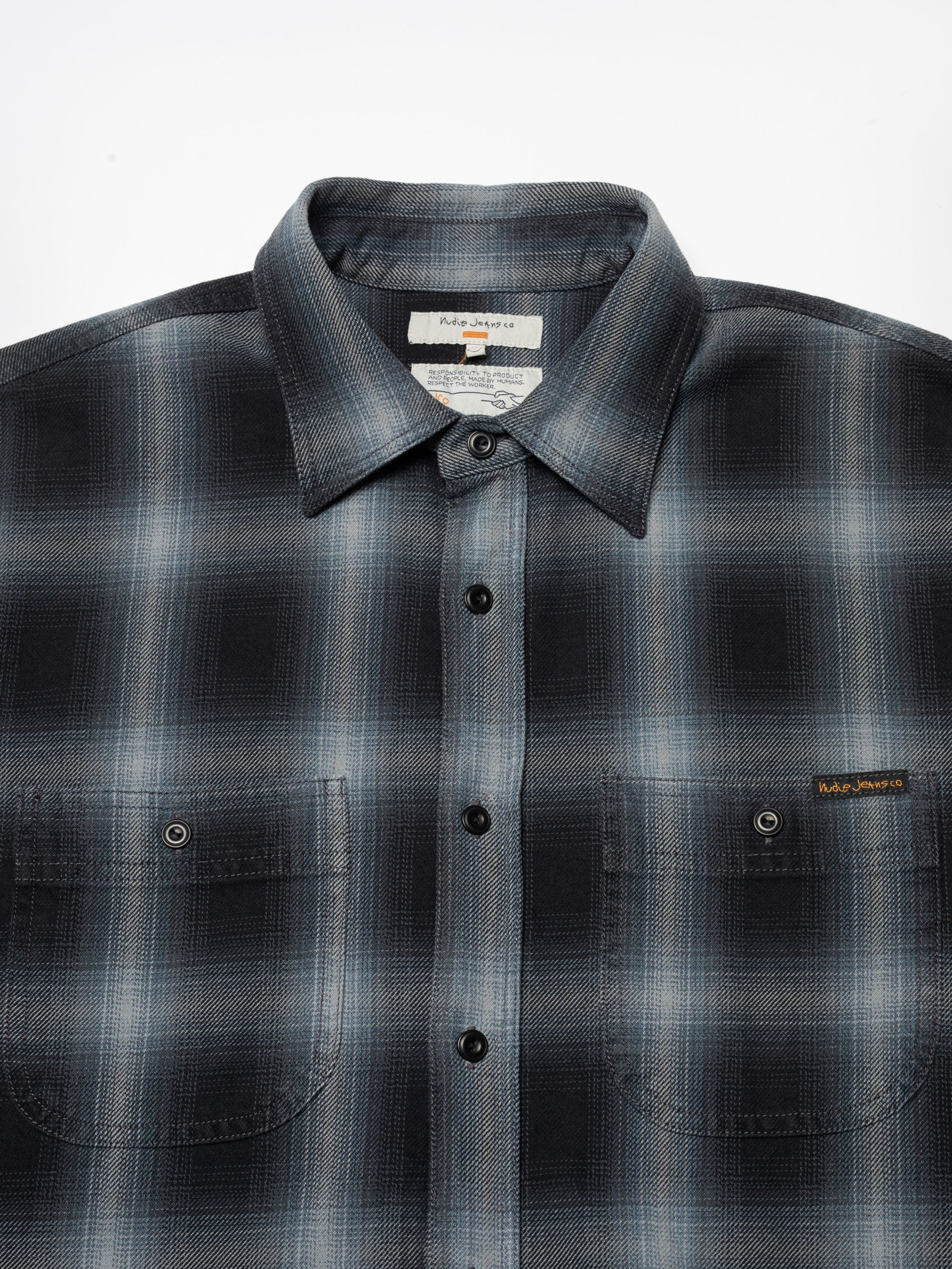 Nudie Jeans Julian Worker Shadow Check Shirt, a close-up of the collar, button placket, and chest pockets.