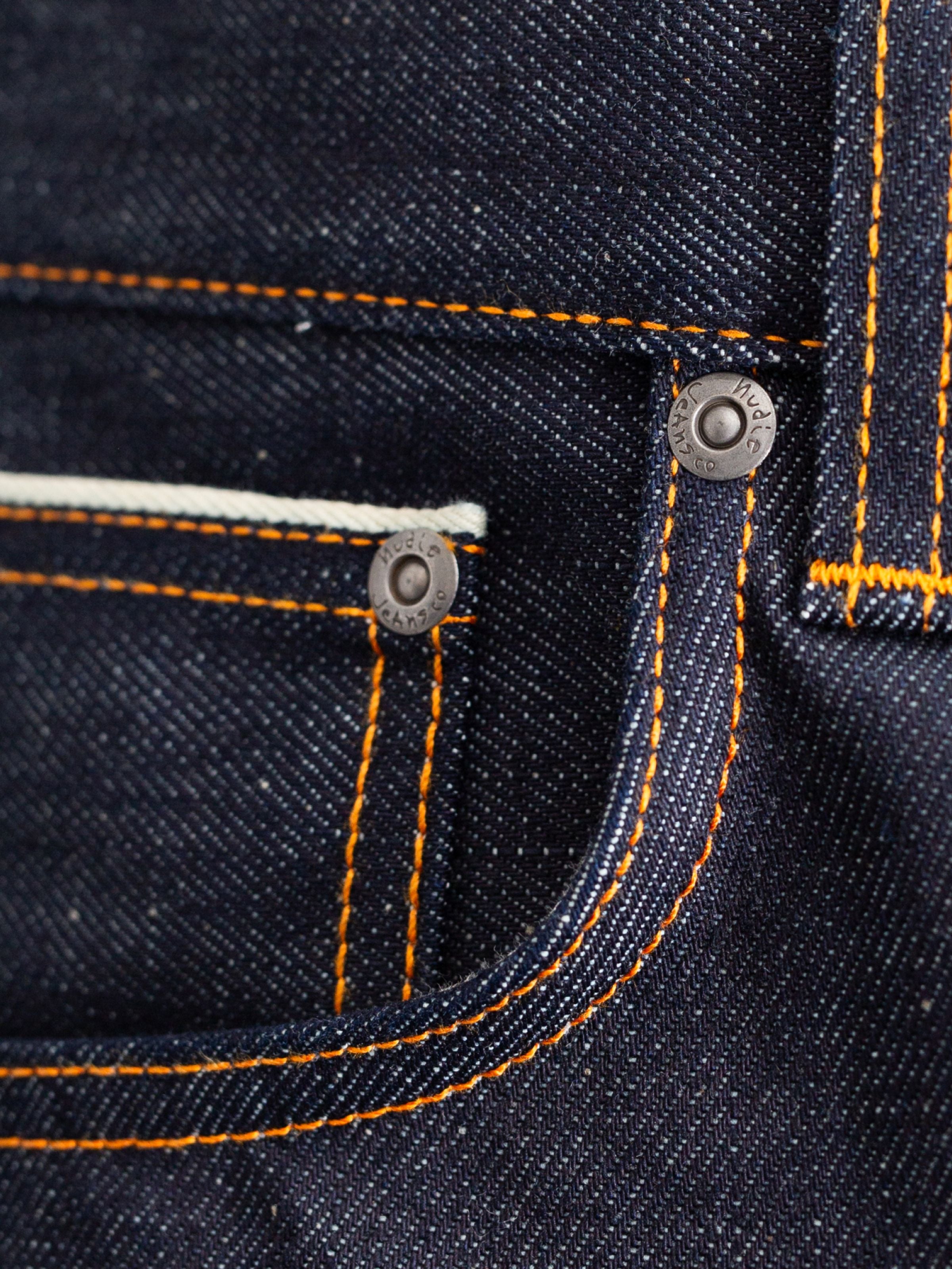 Nudie Jeans Rad Rufus Dry Dusk Selvage, men's regular fit jeans, showing a close-up of the coin pocket with selvedge detail.
