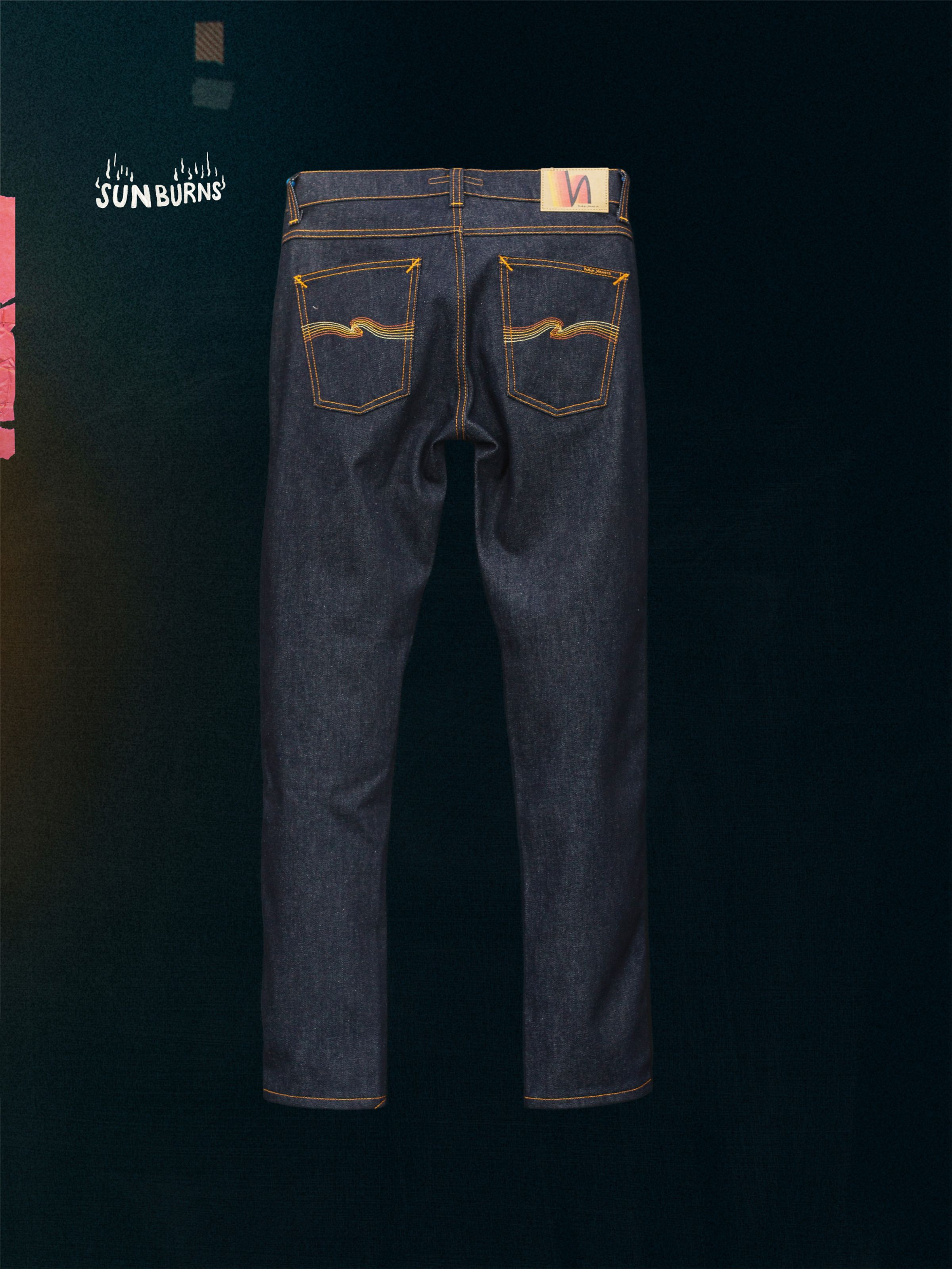 Nudie Jeans Lean Dean Dry Sunburns, a pair of men's slim tapered fit jeans in dark dry denim, shown laid flat from the back.