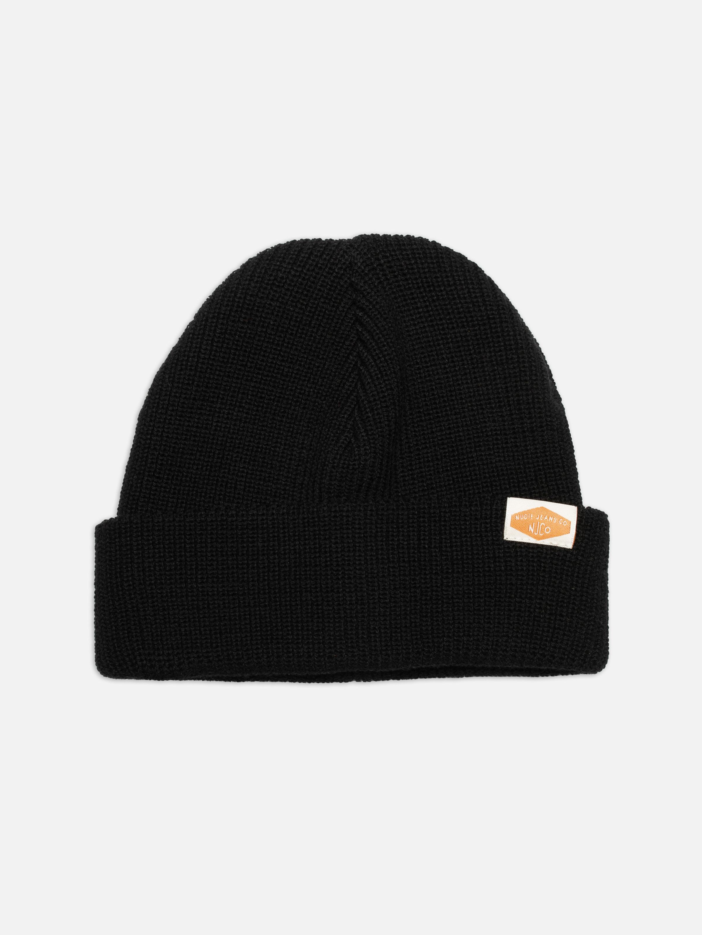 Nudie Jeans Cotton Beanie in black, a unisex ribbed hat shown laid flat.