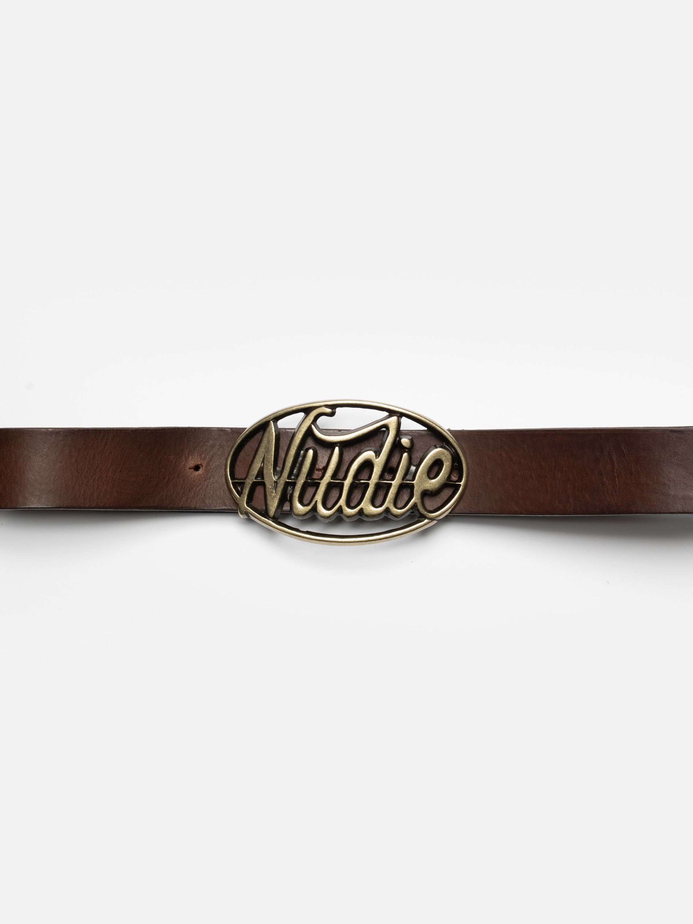 Nudie Jeans Nudie Buckle Leather Belt in Dark Brown, close-up of the antique brass buckle shaped like the Nudie logo.