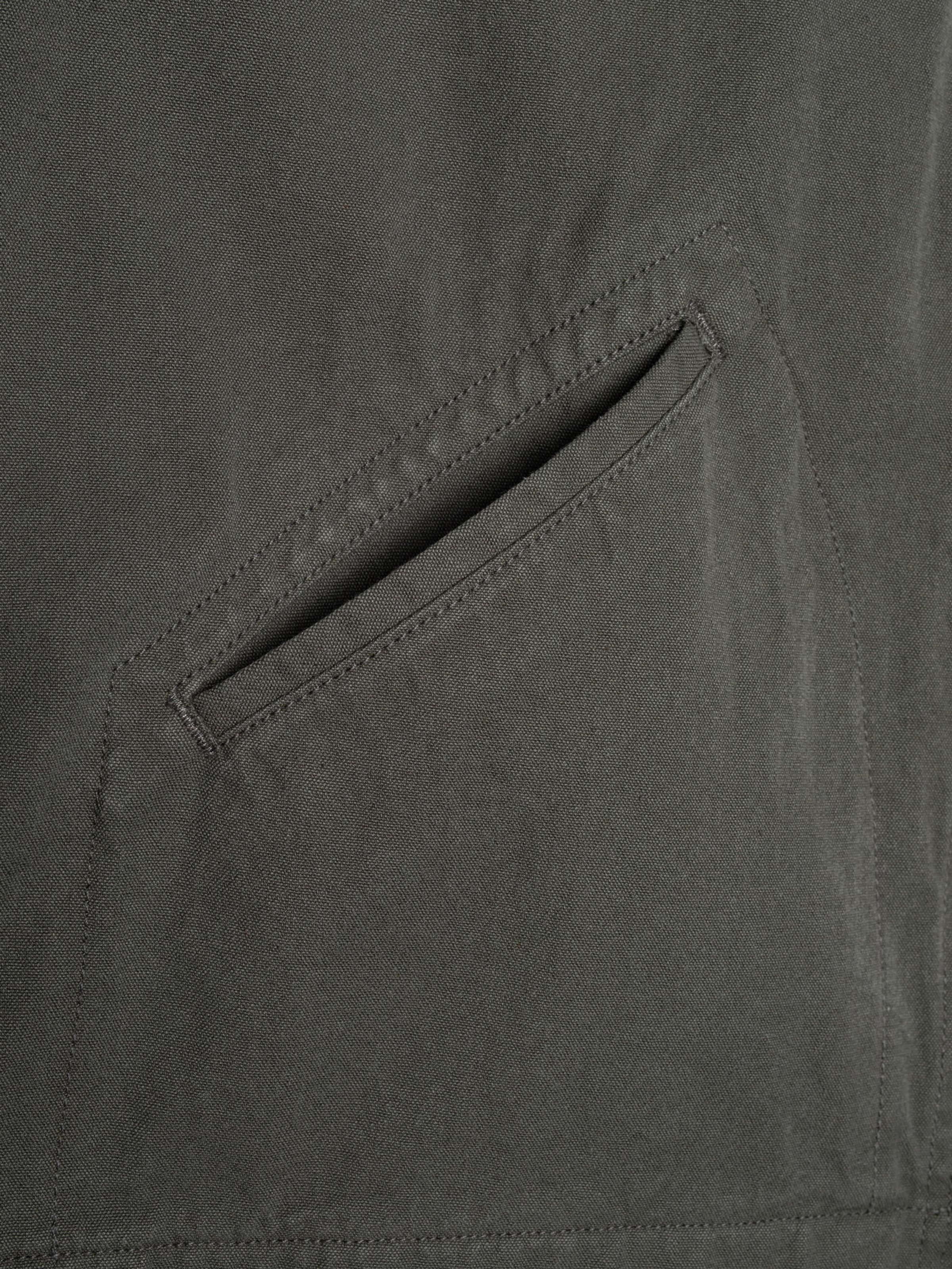 Nudie Jeans Blake Zip Jacket Duck Canvas Green, close-up of the welt pocket detail.