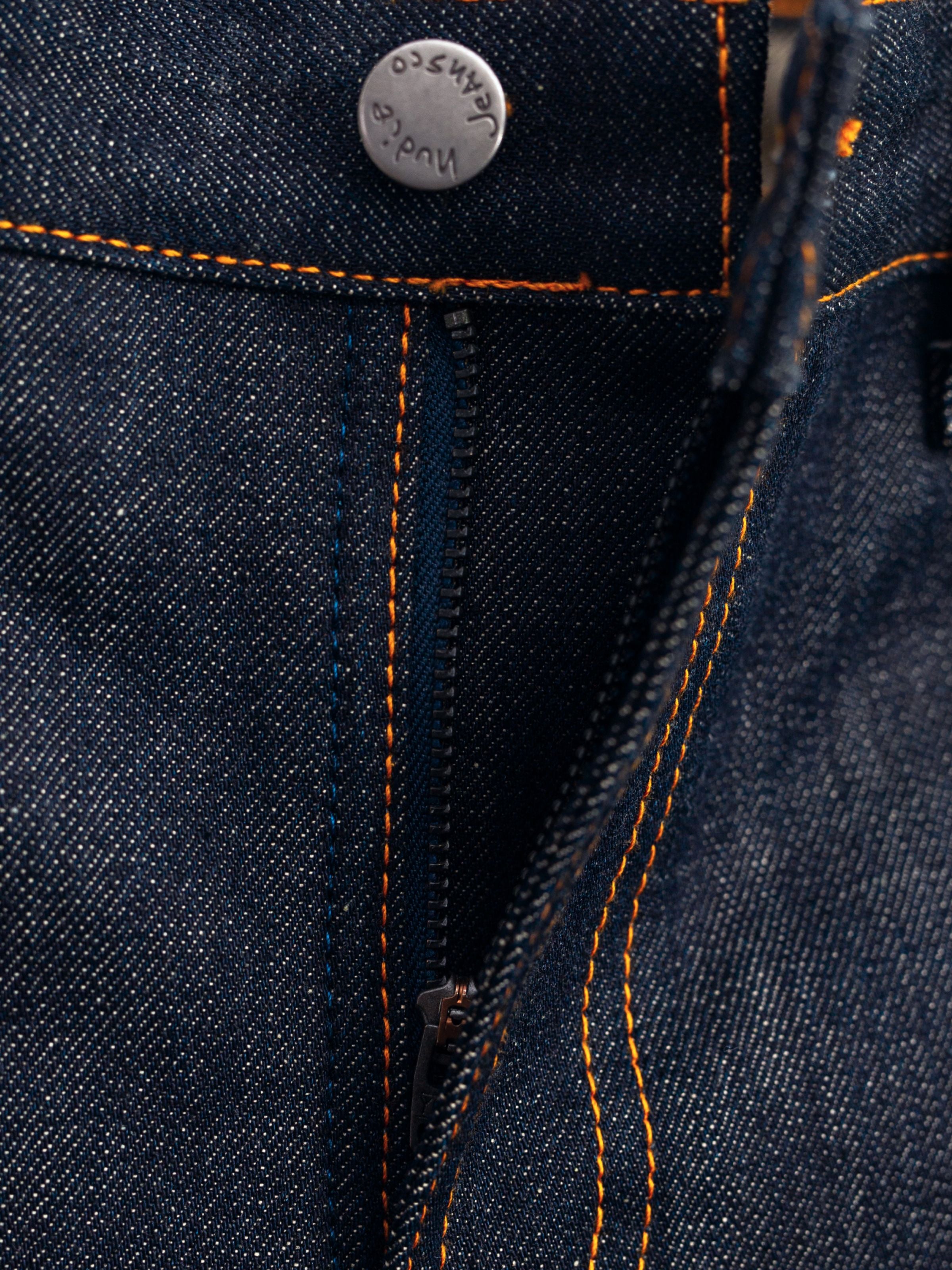 Gritty Jackson Dry Dusk Selvage, Nahaufnahme des Reißverschlusses und der orangefarbenen Nähte im raw selvedge Denim.