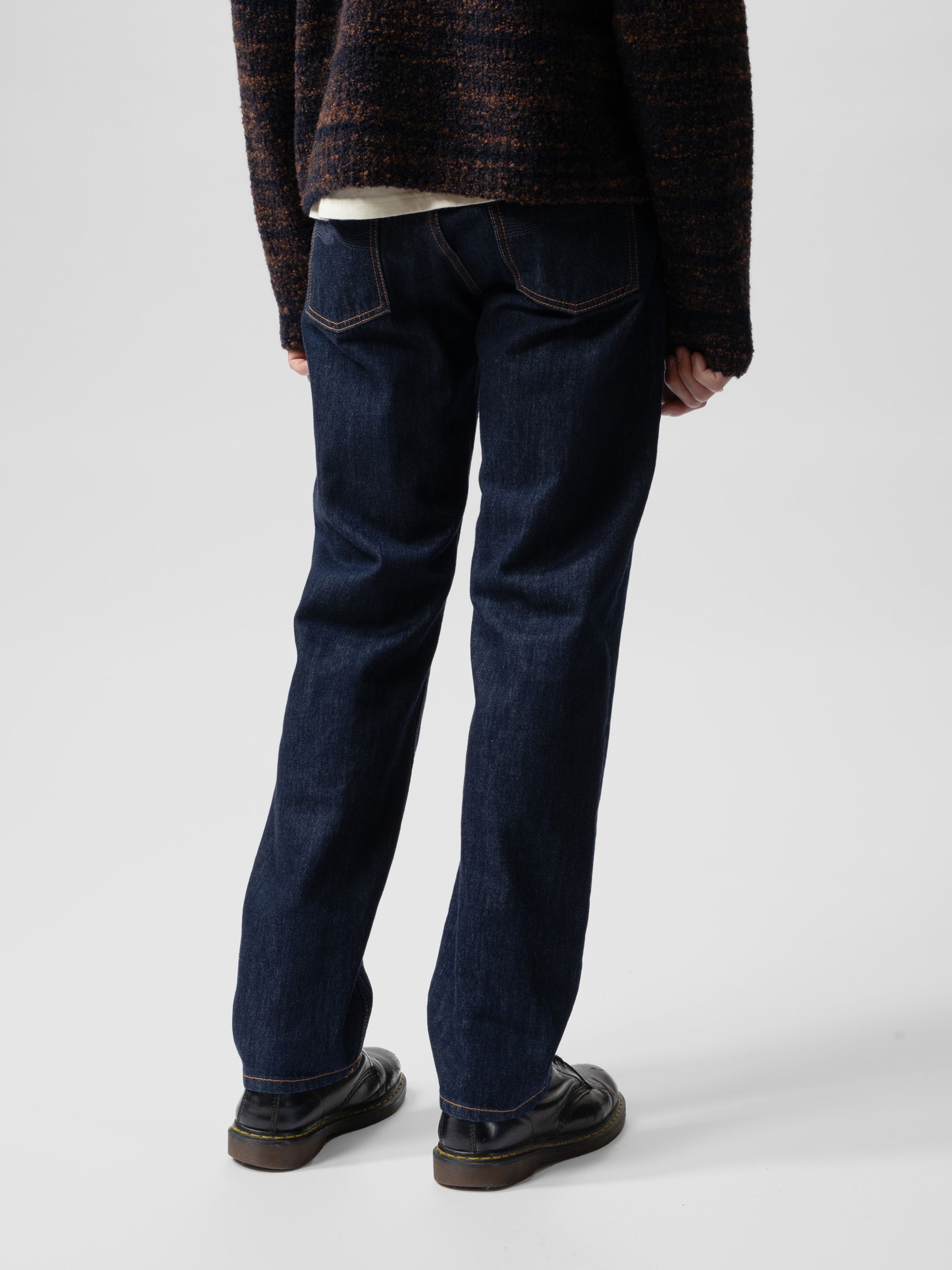 Nudie Jeans Rad Rufus in Blue One Wash, men's regular fit jeans shown from behind on a model.