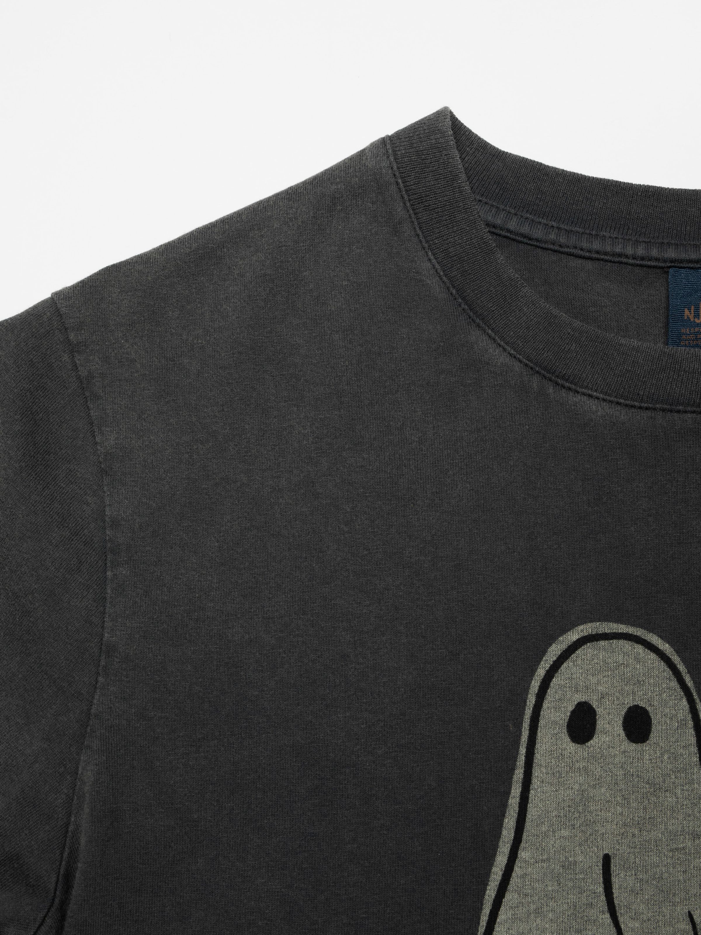 Nudie Jeans Joni Pale Ghost T-Shirt in antracite, a women's t-shirt, shown in a close-up of the crew neck and ghost print.