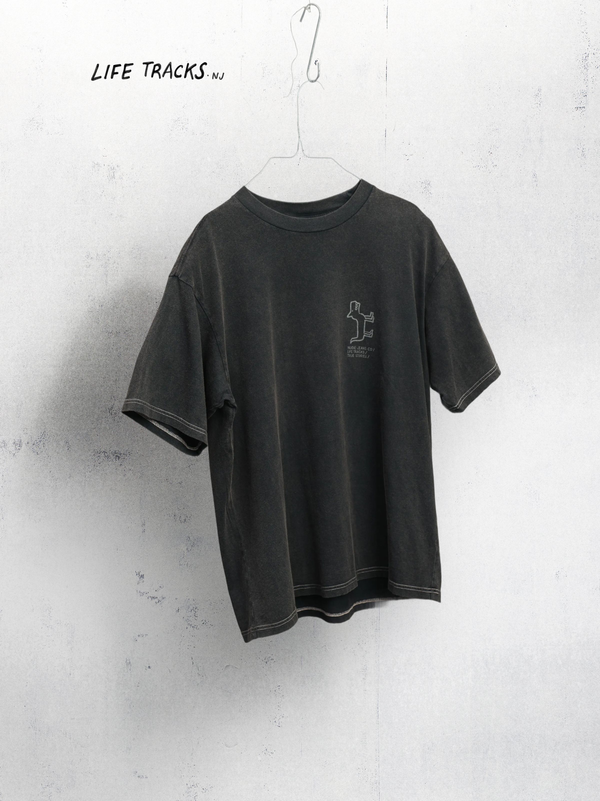 Nudie Jeans Koffe Scratched Tracks T-Shirt in Antracite, a men's relaxed fit t-shirt, shown laid flat.