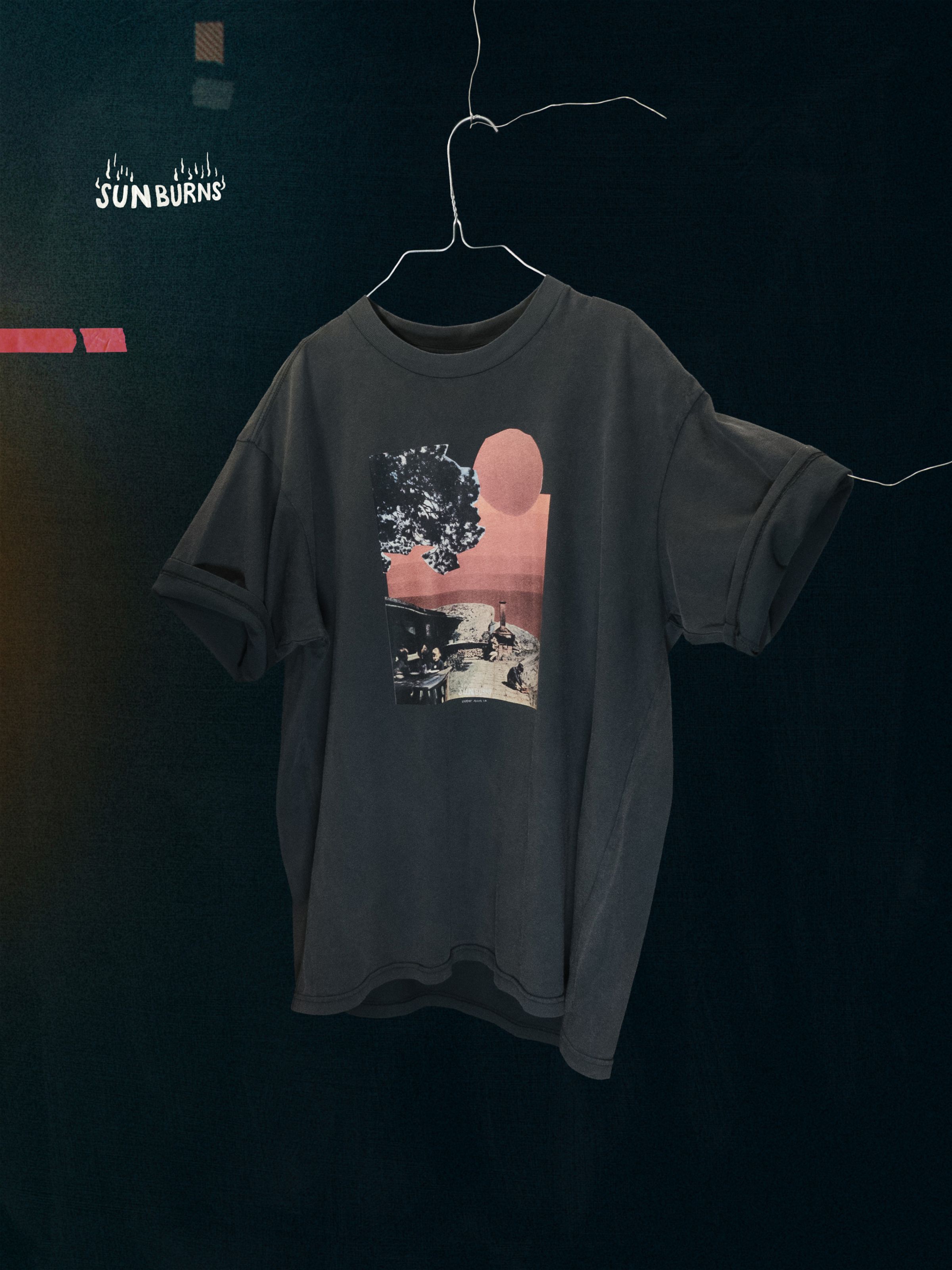Nudie Jeans Koffe Sunburns T-Shirt in Antracite, a men's relaxed fit t-shirt shown hanging on a wire hanger.