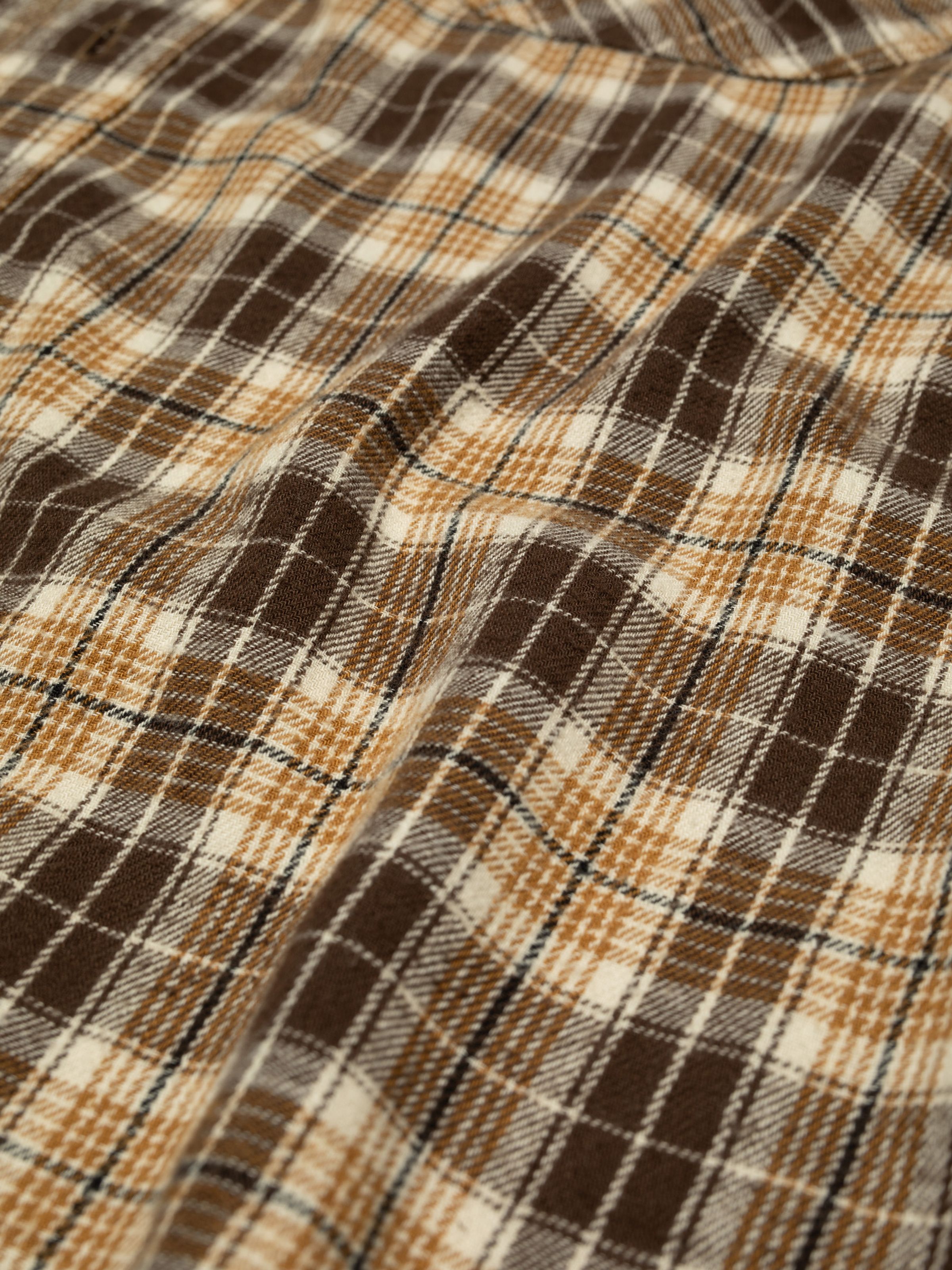 Nudie Jeans Julian Worker Shirt Check Brown, a men's shirt, shown in a close-up of the brown checked cotton-linen fabric.