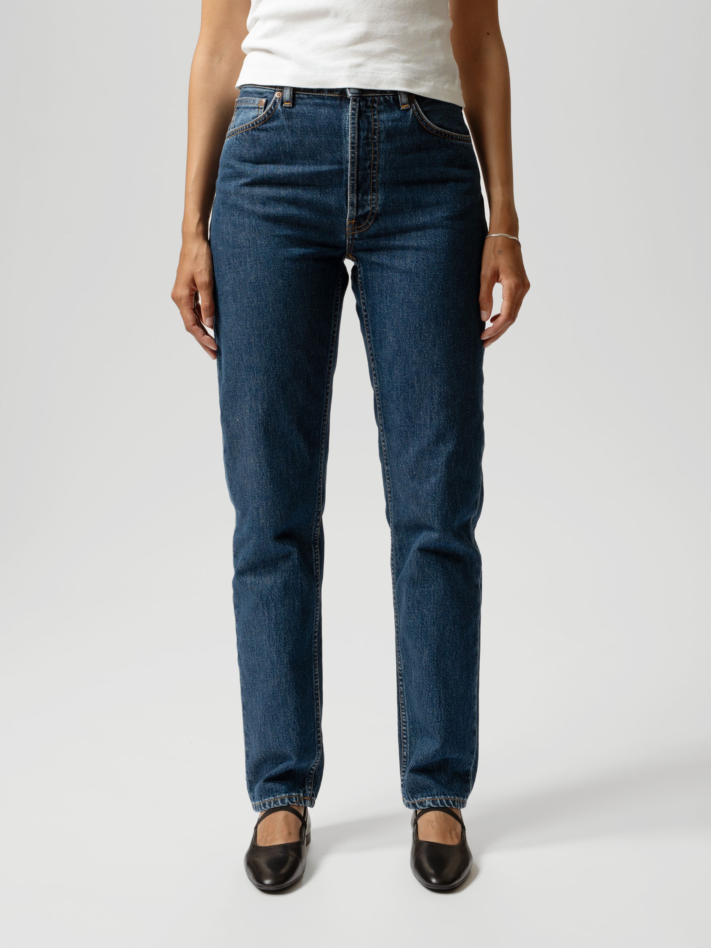 Nudie Jeans Breezy Britt in Evening Jazz, a women's regular tapered fit jean worn by a model and shown from the front.