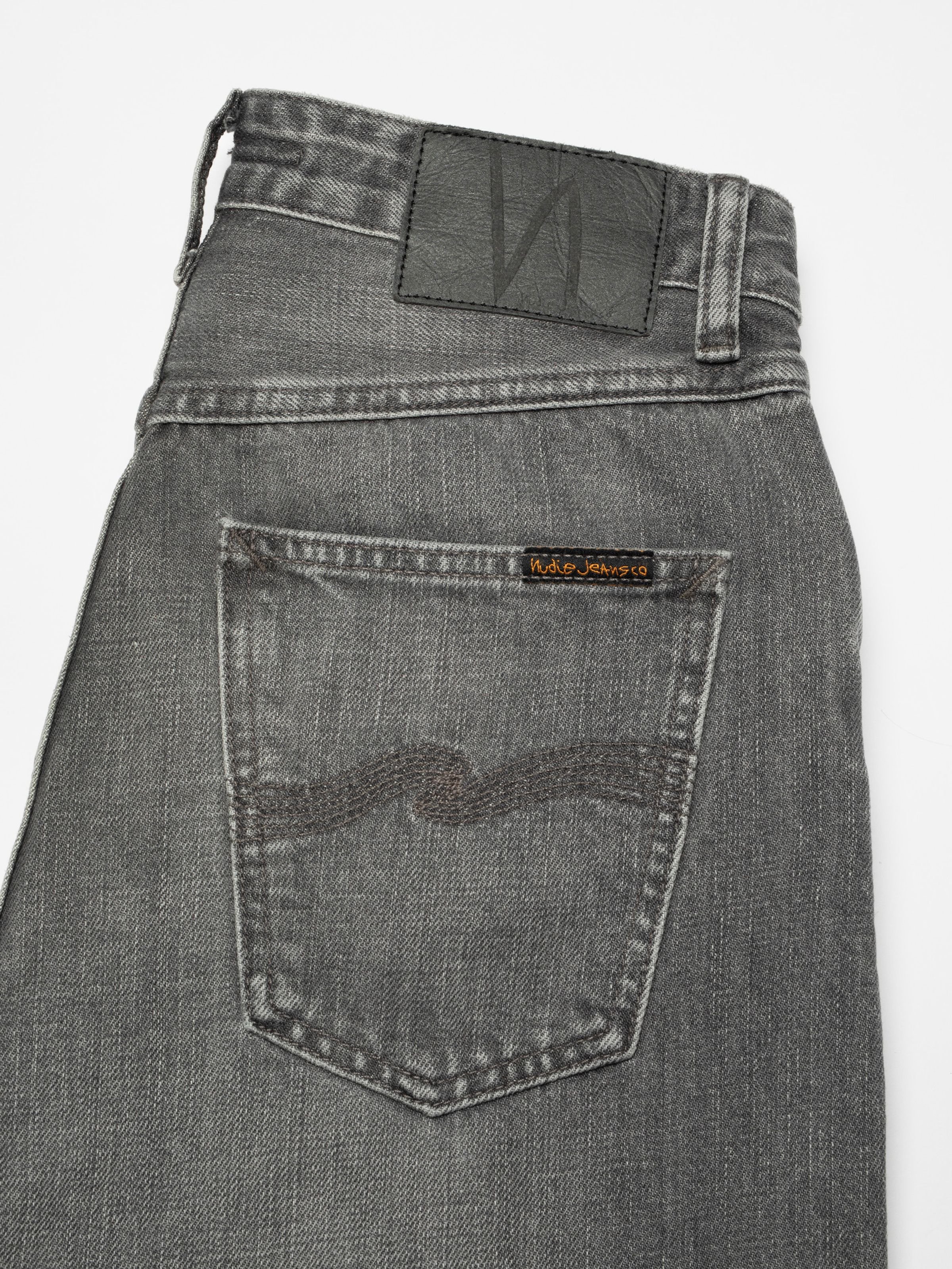 Nudie Jeans Lofty Lo Foggy Grey, a pair of women's regular fit jeans in foggy grey, showing a close-up of the back pocket.