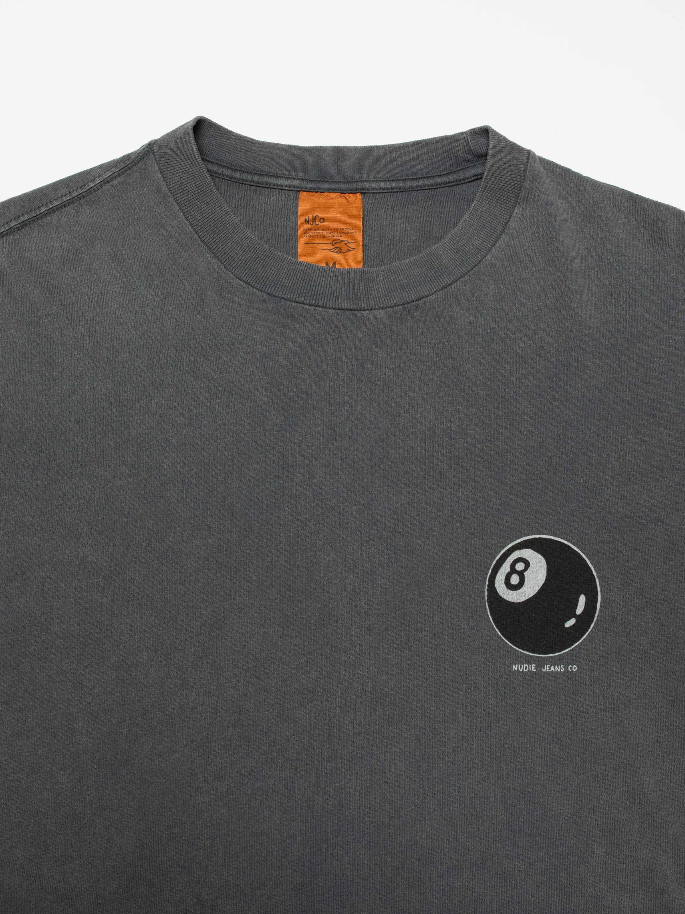 Nudie Jeans Koffe Knock-Topus T-Shirt in Antracite, showing a close-up of the neck and 8-ball chest print.