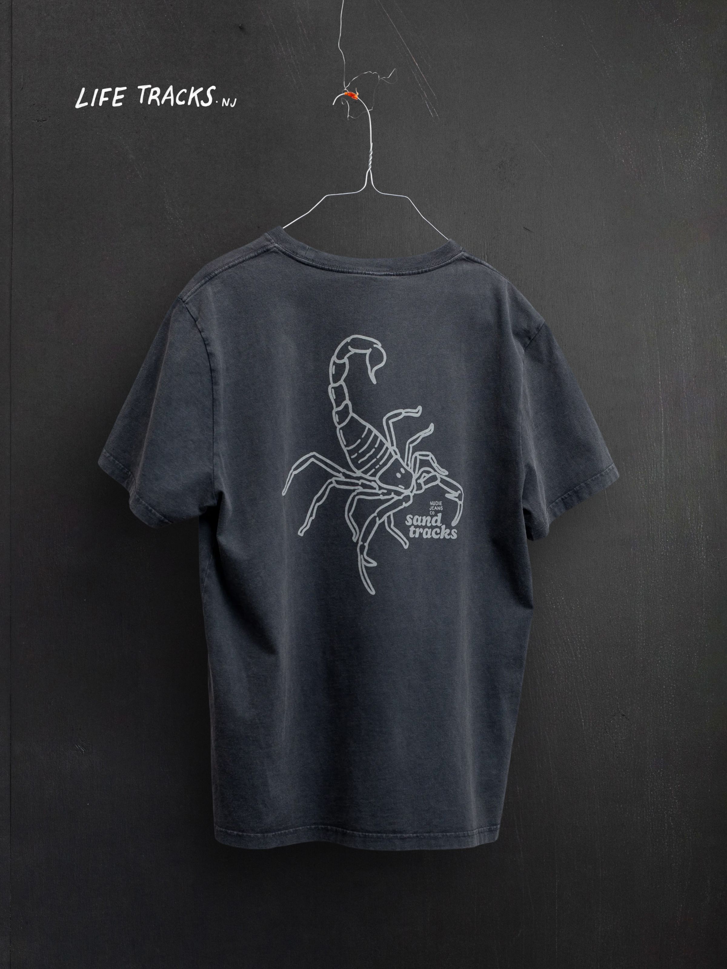 Nudie Jeans Roy Sand Tracks T-Shirt, men's regular fit T-shirt shown from the back displaying the scorpion graphic.