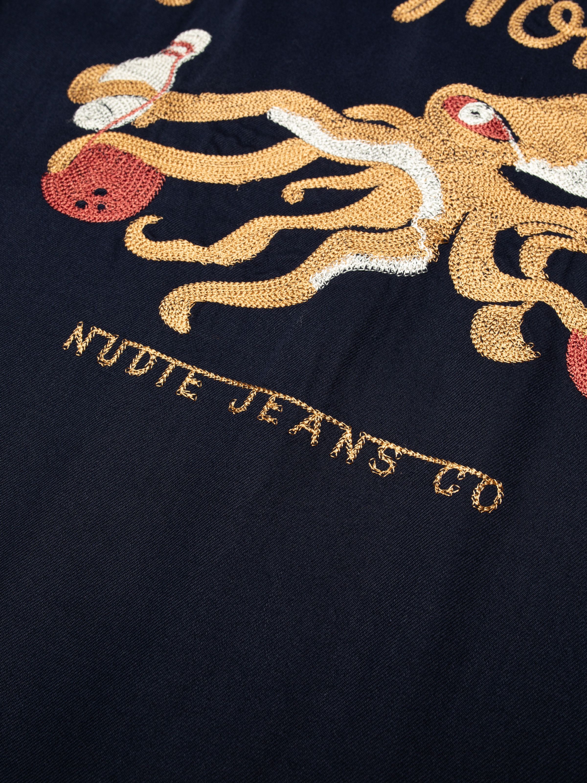 Nudie Jeans Arthur Bowling Shirt 8 Wonders in navy, octopus and Nudie Jeans Co chain stitch embroidery on the back.
