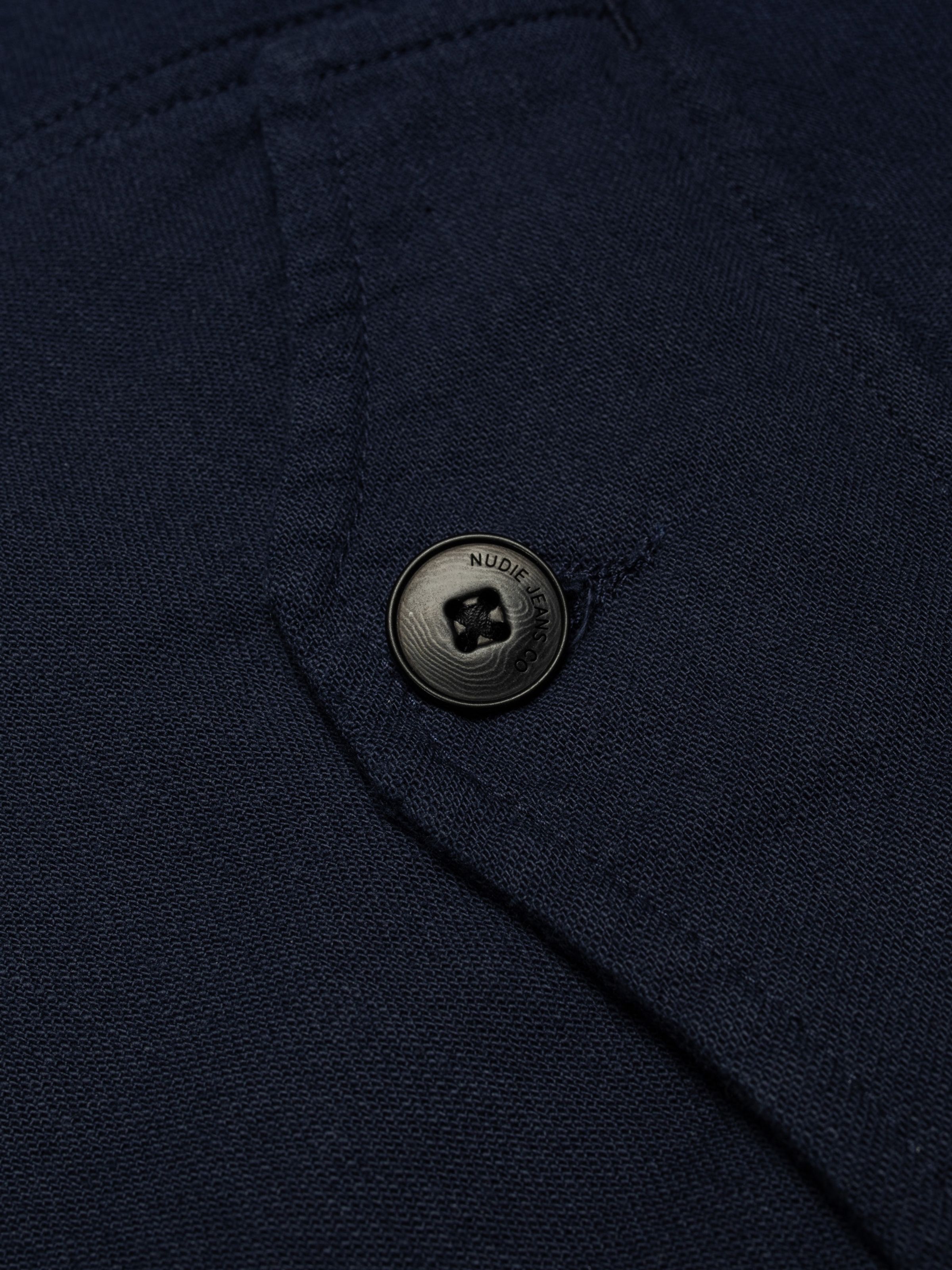 Nudie Jeans Blake Zip Jacket Back Sateen in Navy, showing a close-up of a branded antique silver button.
