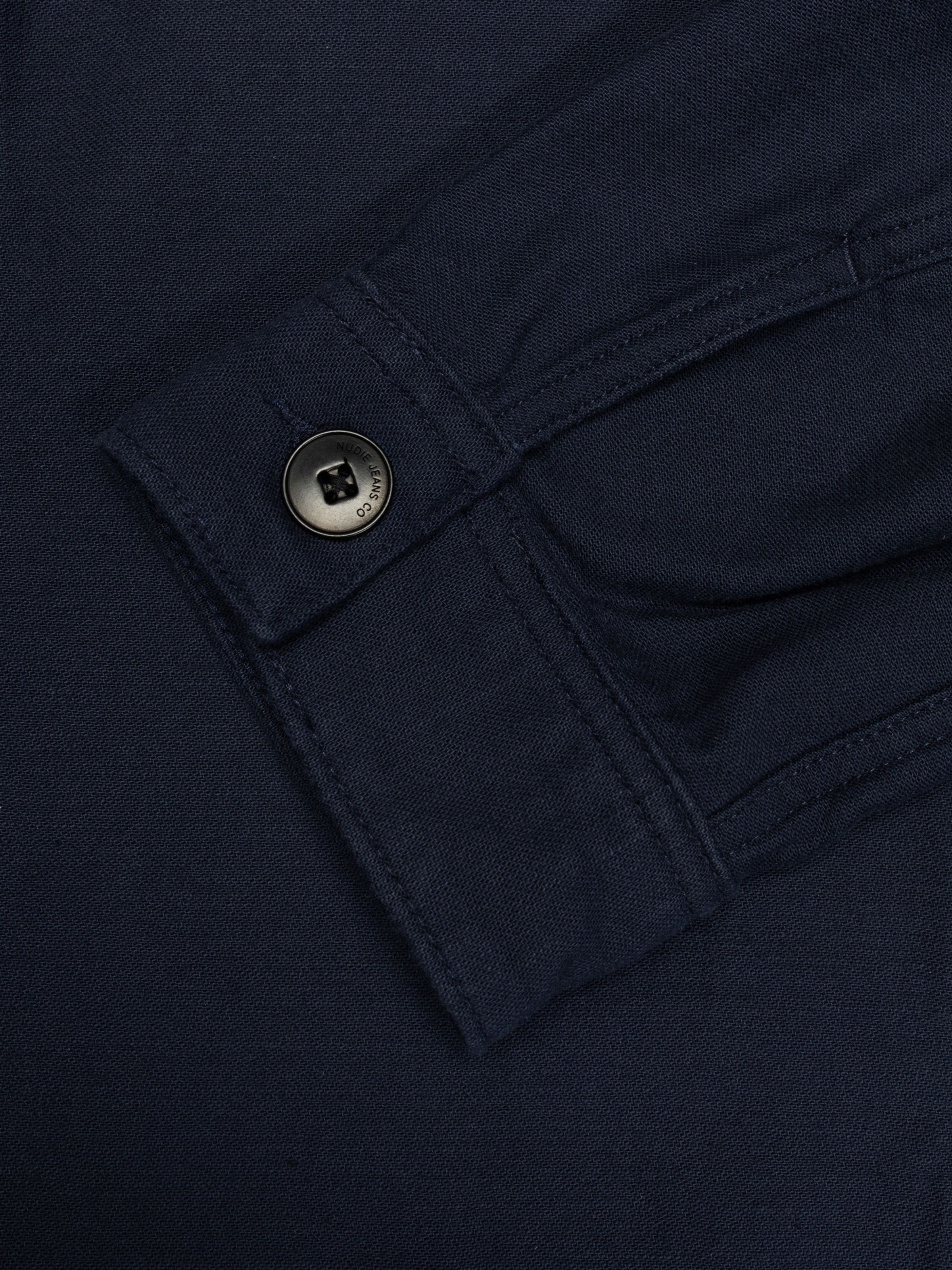Nudie Jeans Blake Zip Jacket Back Sateen in Navy, close-up of the adjustable cuff showing the branded antique silver button.