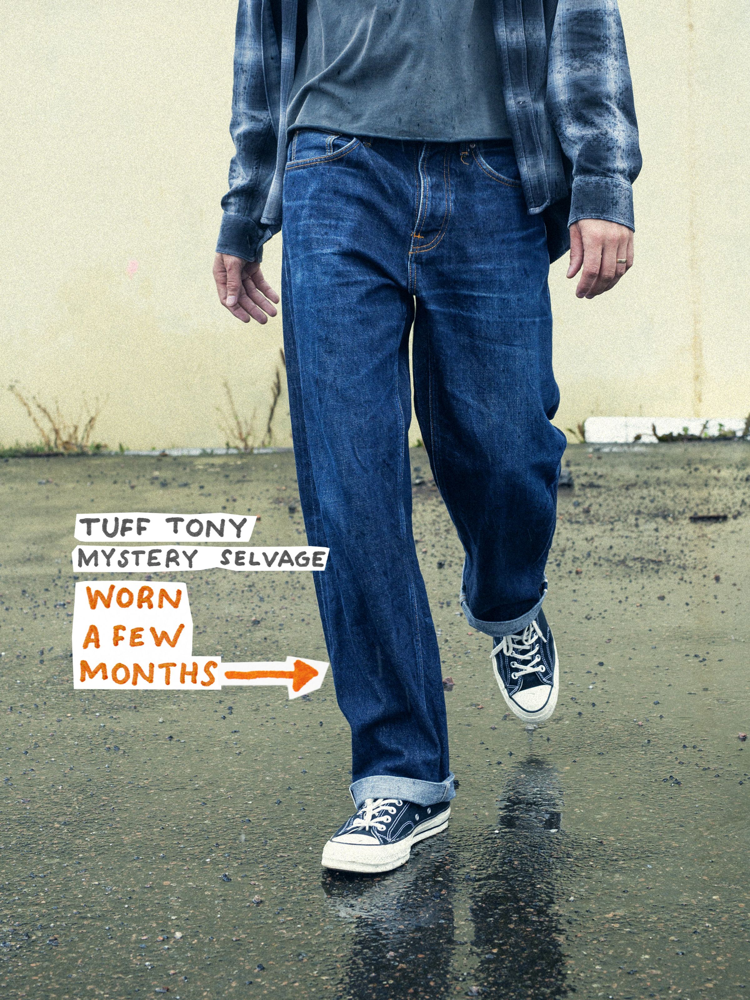 Nudie Jeans Tuff Tony Mystery Selvage, a men's loose fit jean, shown worn-in by a model from the front.