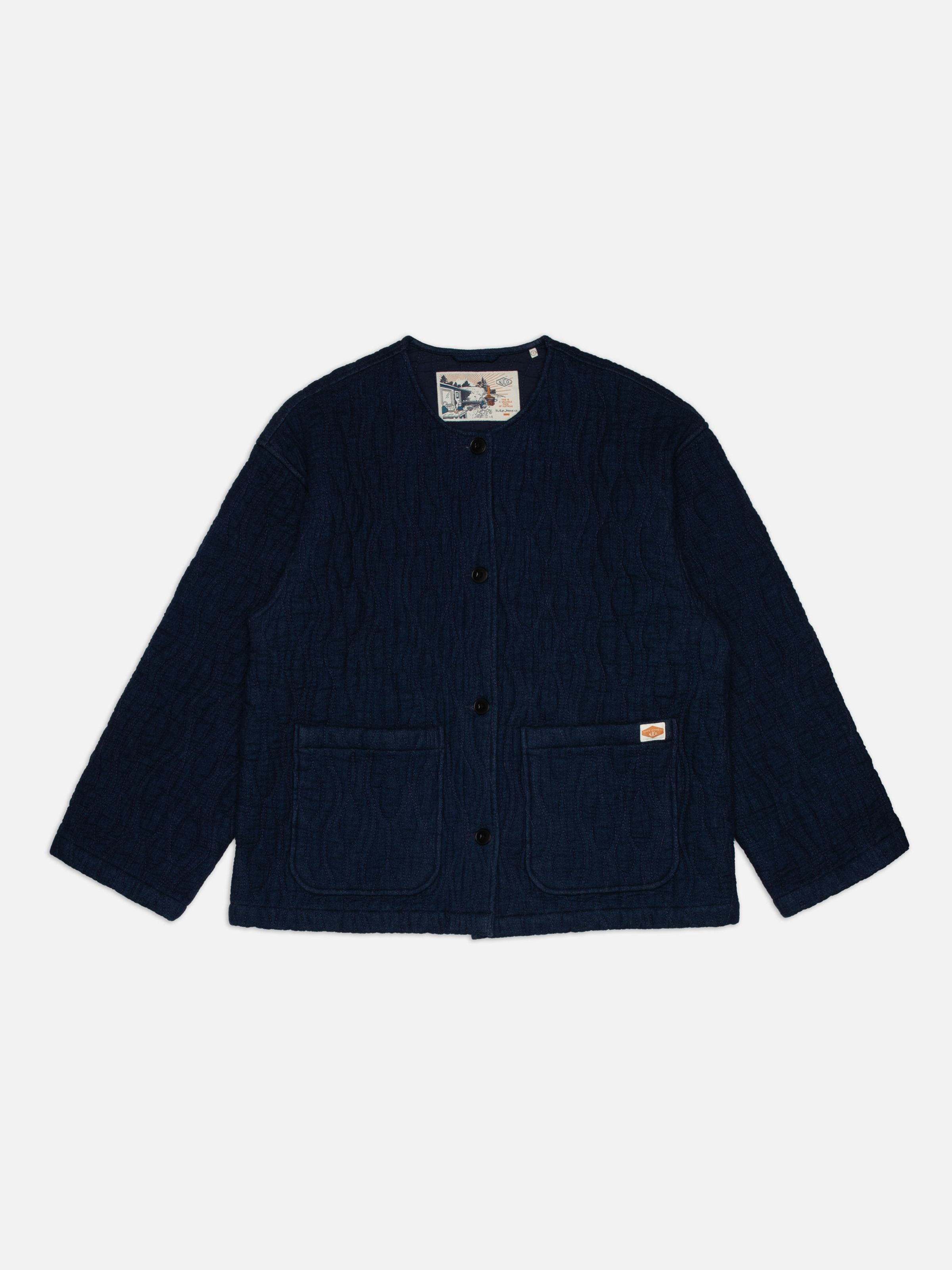 Nudie Jeans Sandra Jacket Indigo Quilt Blue, women's quilted jacket shown in a flat lay.