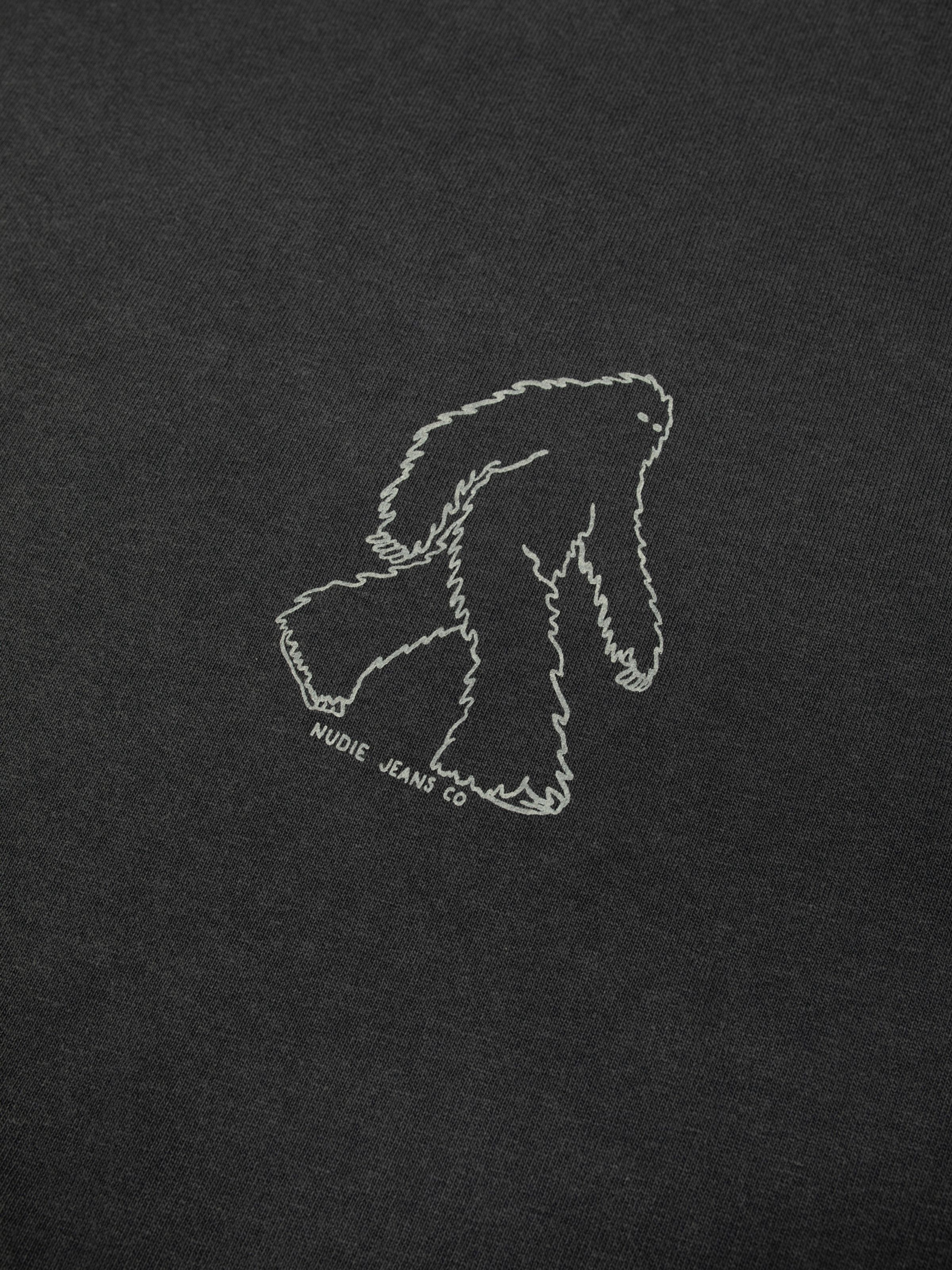 Nudie Jeans Karita Icy Long Sleeve T-Shirt in Antracite, close-up of the Yeti print on the chest.