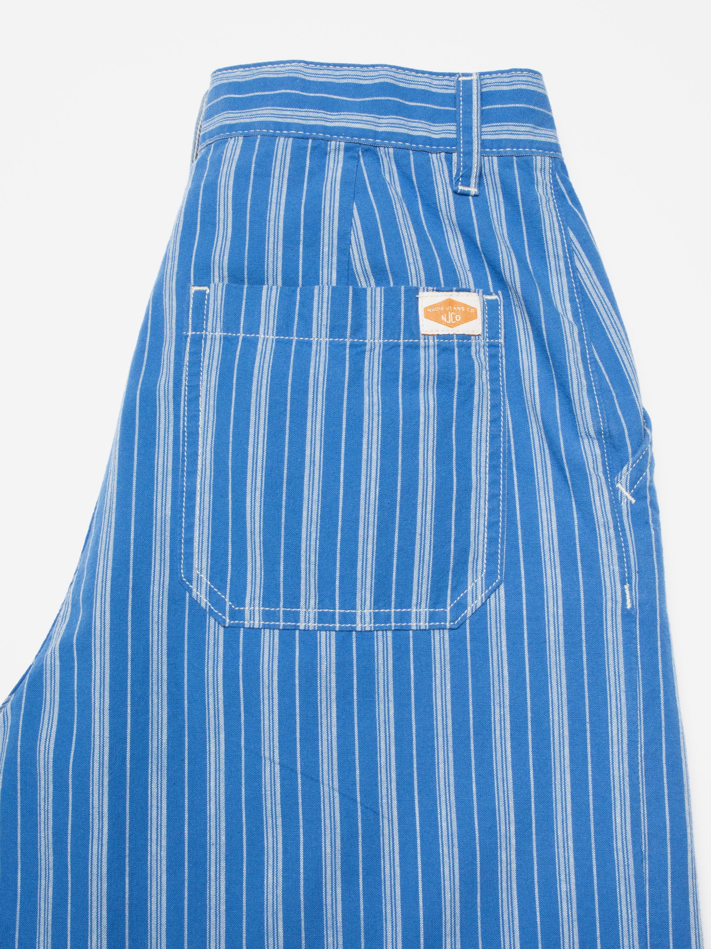 Nudie Jeans Gullan Pants Striped, women's loose fit pants, showing a close-up of the back pocket and striped pattern.