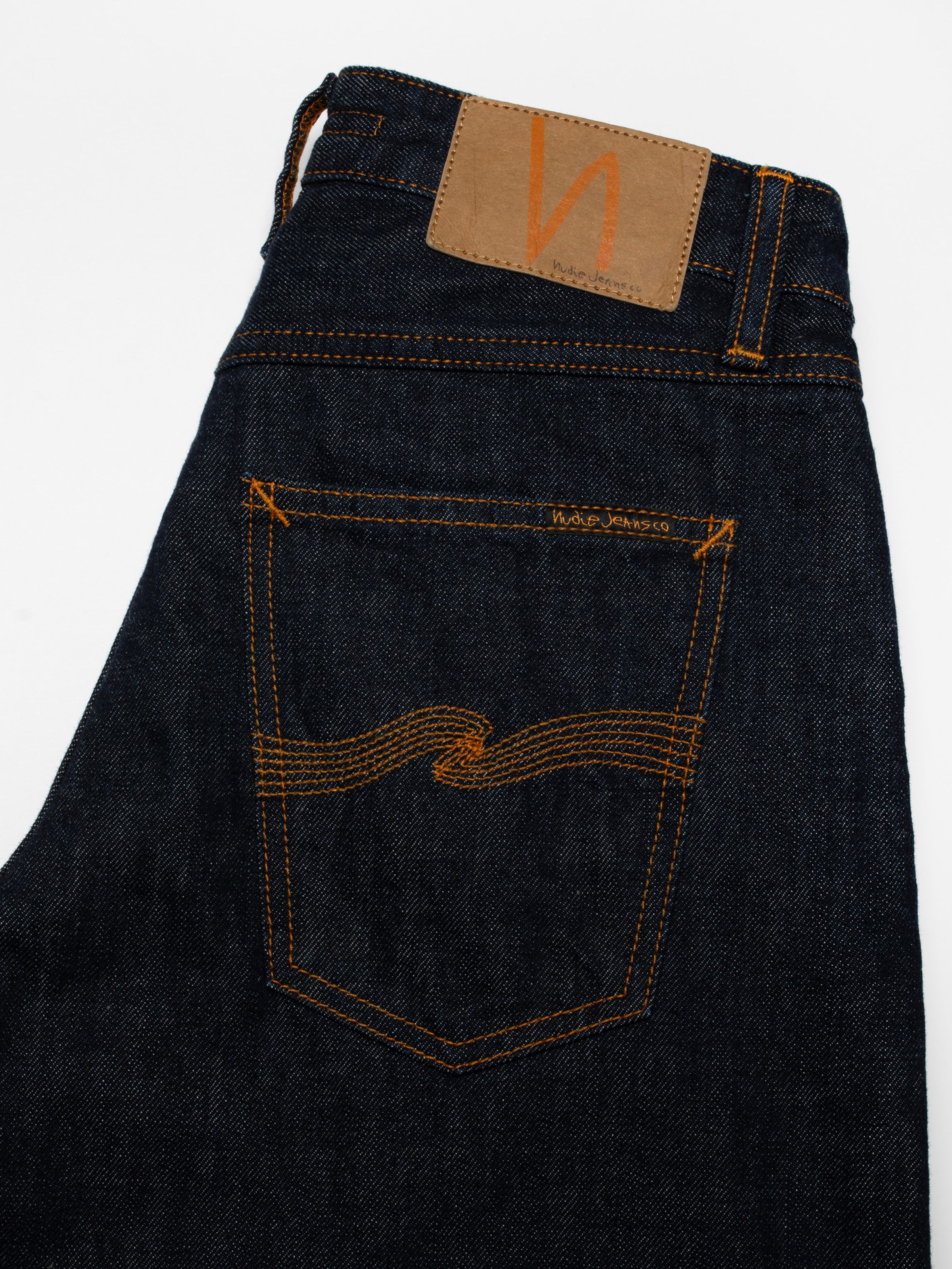 Nudie Jeans Sonic Sue One Wash, women's loose fit jeans showing a close-up of the back pocket and jacron patch.