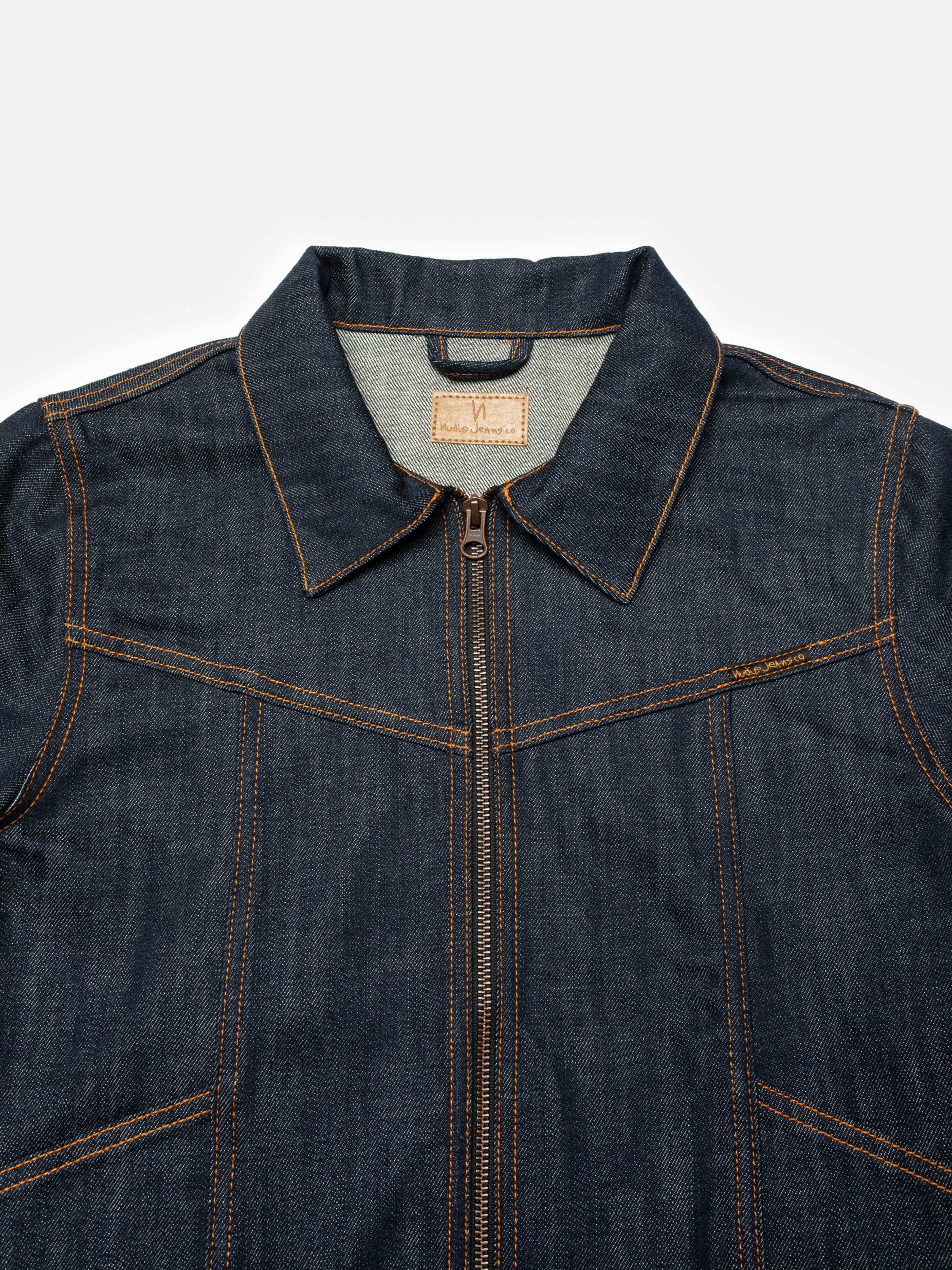 Nudie Jeans Britta Denim Jacket Dry Streaky, women's slim fit denim jacket, close-up of the collar and zip front.