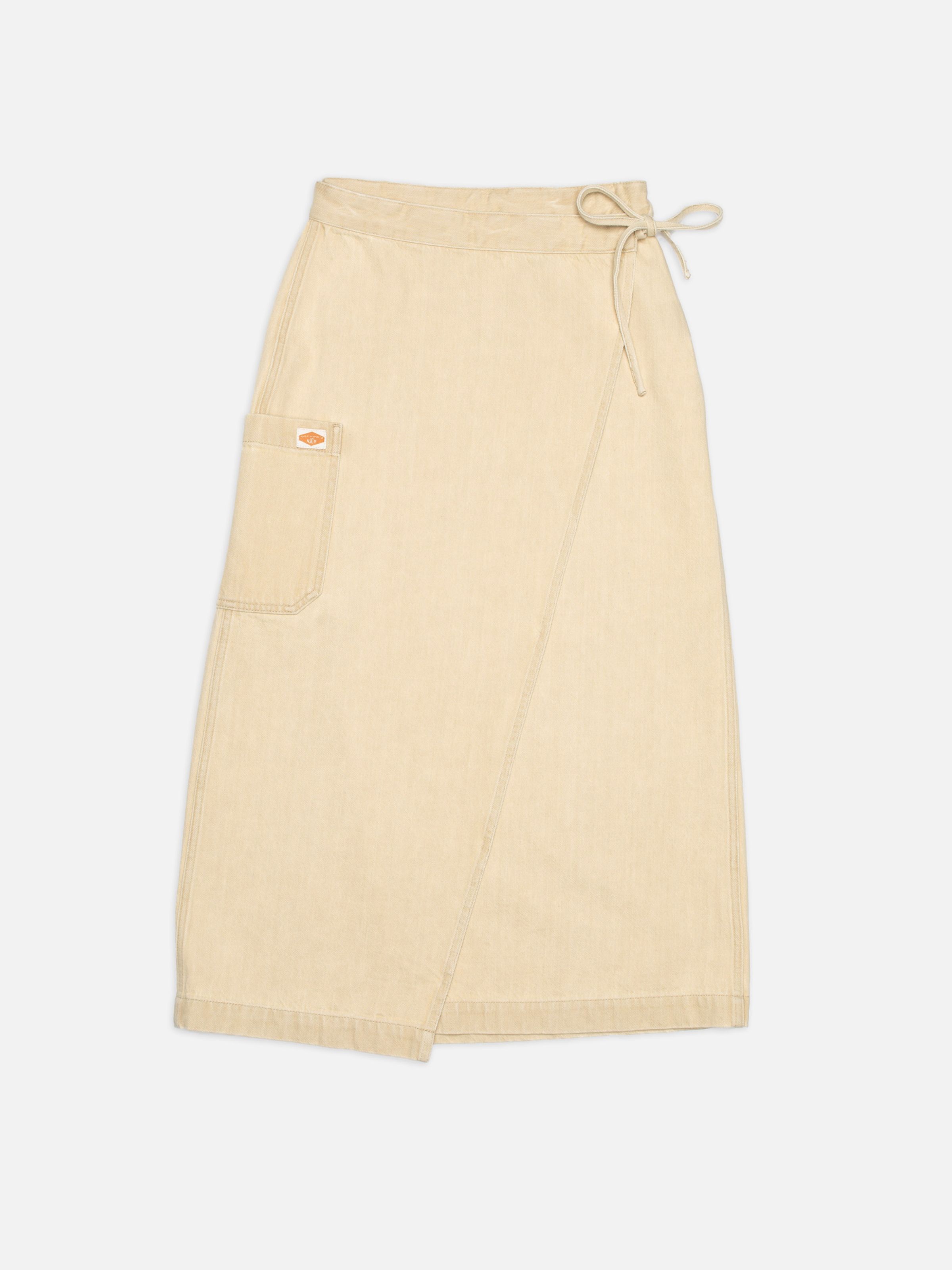 Nudie Jeans Irma Skirt Denim in Pale Yellow, women's denim wrap skirt shown laid flat.