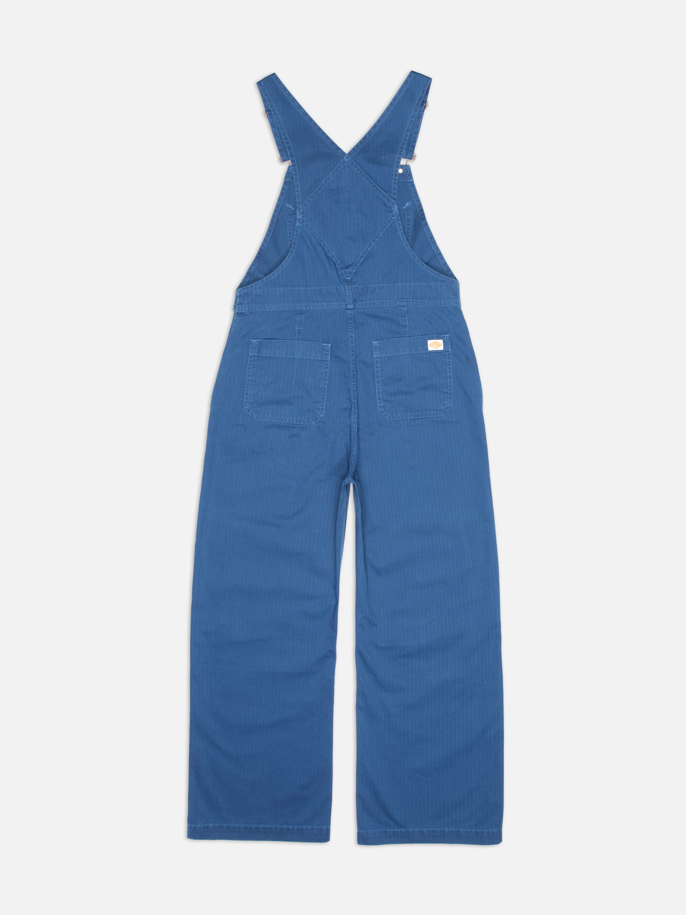 Nudie Jeans Klara Dungarees Herringbone, women's blue dungarees shown from the back.